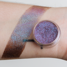 NABA Cosmetics USA Pandora Pigment in a small jar with shimmering pink and purple loose cosmetic pigment powder.