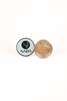 NABA Cosmetics USA Pocky Pigment in a vibrant, shimmery eyeshadow container with a clear lid showing the colorful pigment inside.