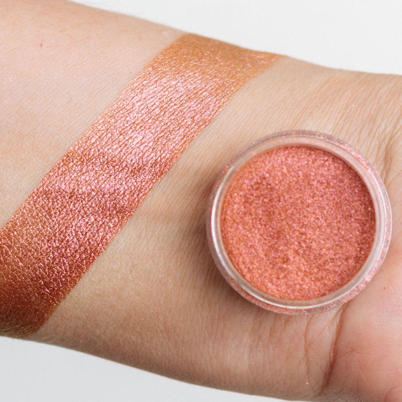 NABA Cosmetics USA Juana Pigment eyeshadow in vibrant shade, close-up of the colorful powder in a compact container.