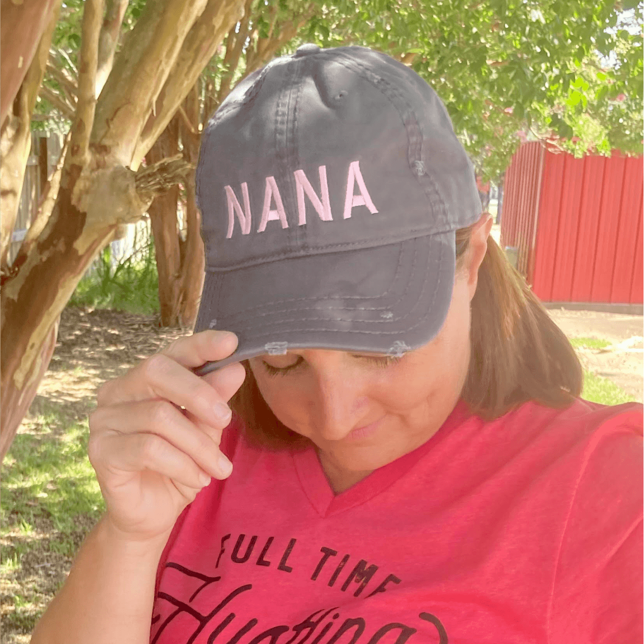 Nana charcoal distressed canvas cap by The Graphic Tee featuring a curved brim and casual style.
