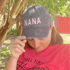 Nana charcoal distressed canvas cap by The Graphic Tee featuring a curved brim and casual style.