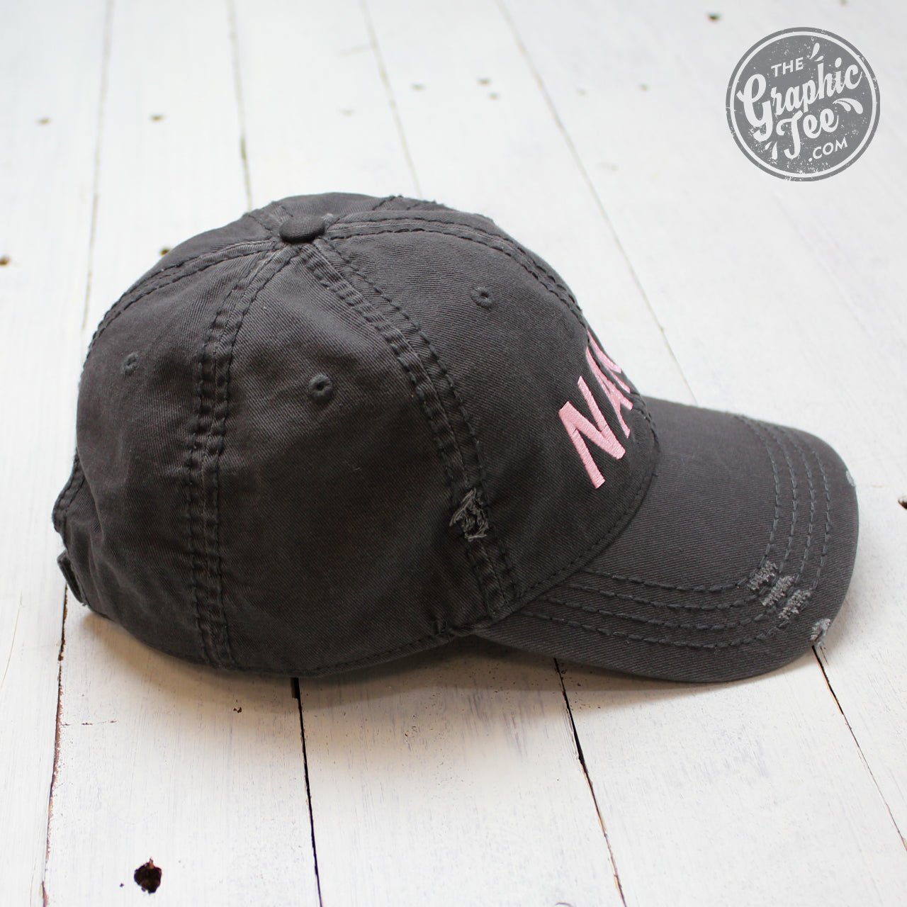 Charcoal distressed canvas cap by The Graphic Tee featuring a casual, worn-in look and a curved brim.