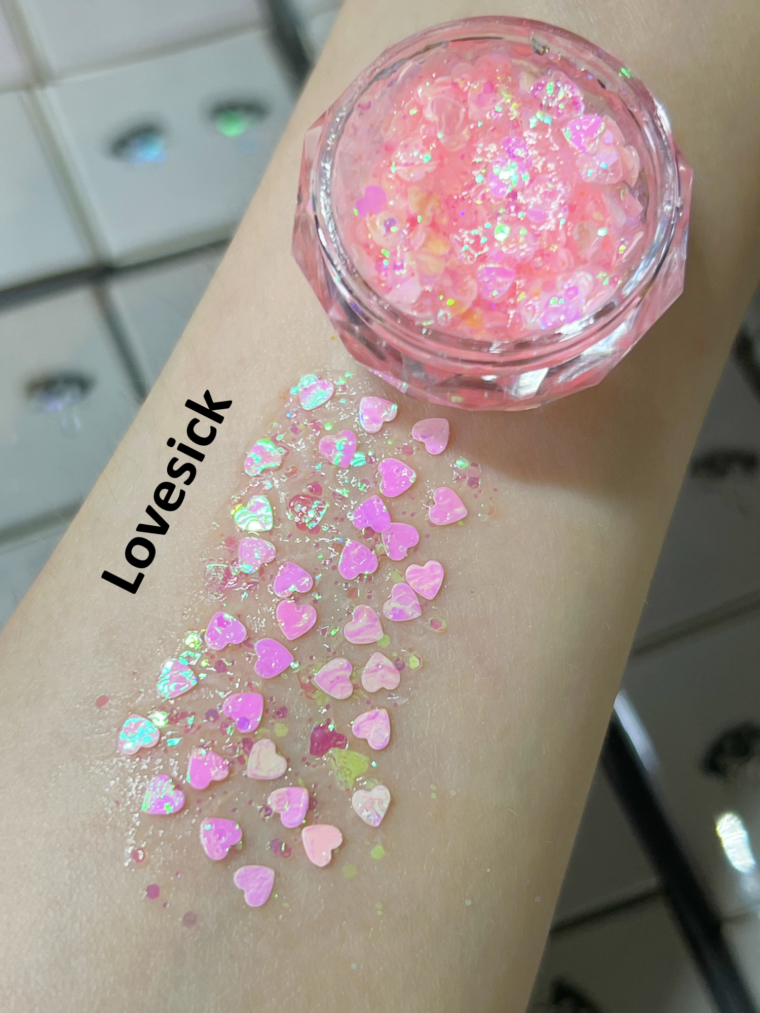 Nekoyanin Gel Glitter Tears in a jar with shimmering gold glitter, showcasing the sparkling, gel-based cosmetic product.