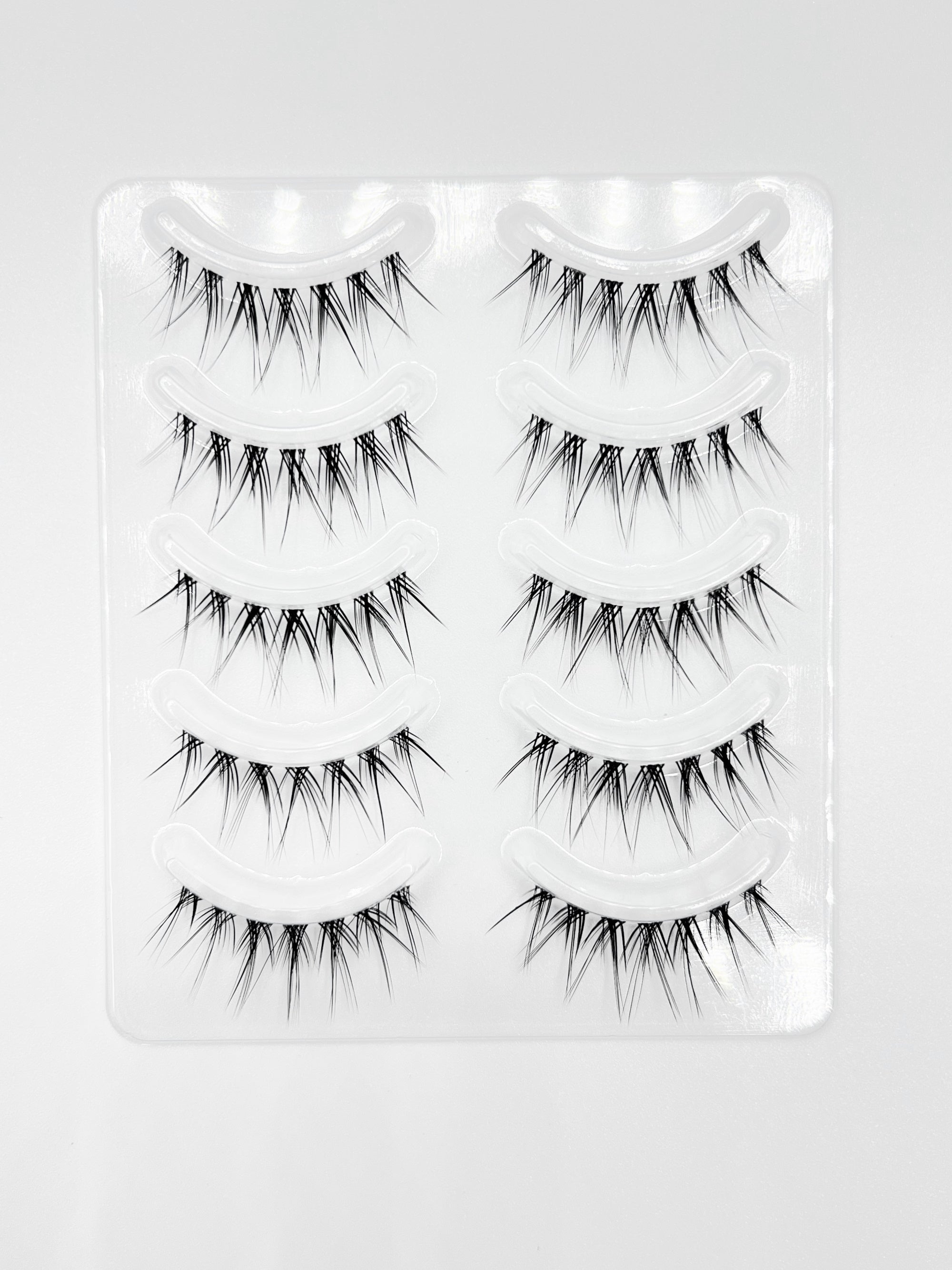 Nekoyanin Zodiac Manga Lashes featuring Cancer zodiac design with long, curled black false eyelashes on a white background.