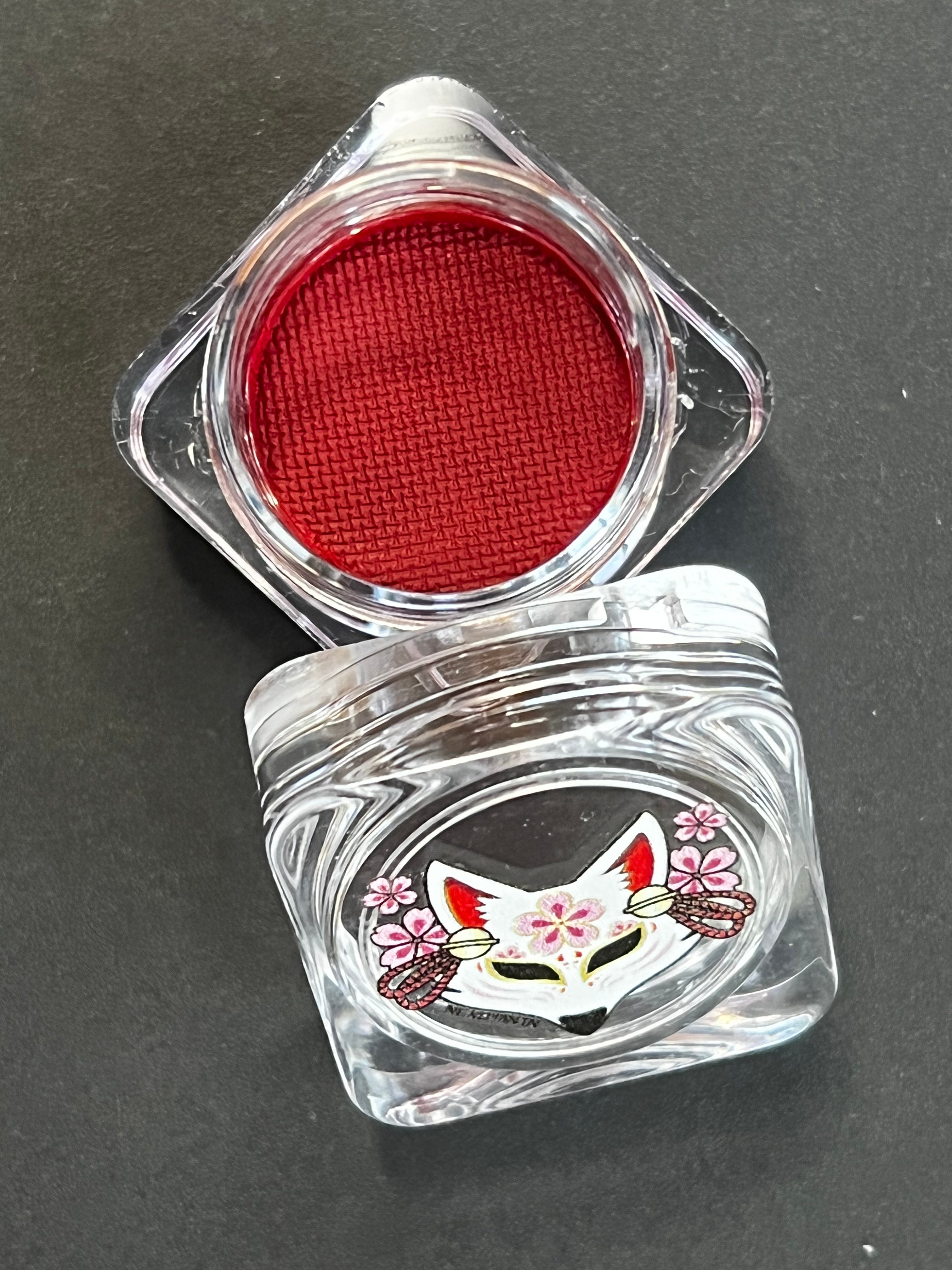 Red Cherry Water Activated Graphic Liner by Nekoyanin showing vibrant red eyeliner with water-activated design on a white background.