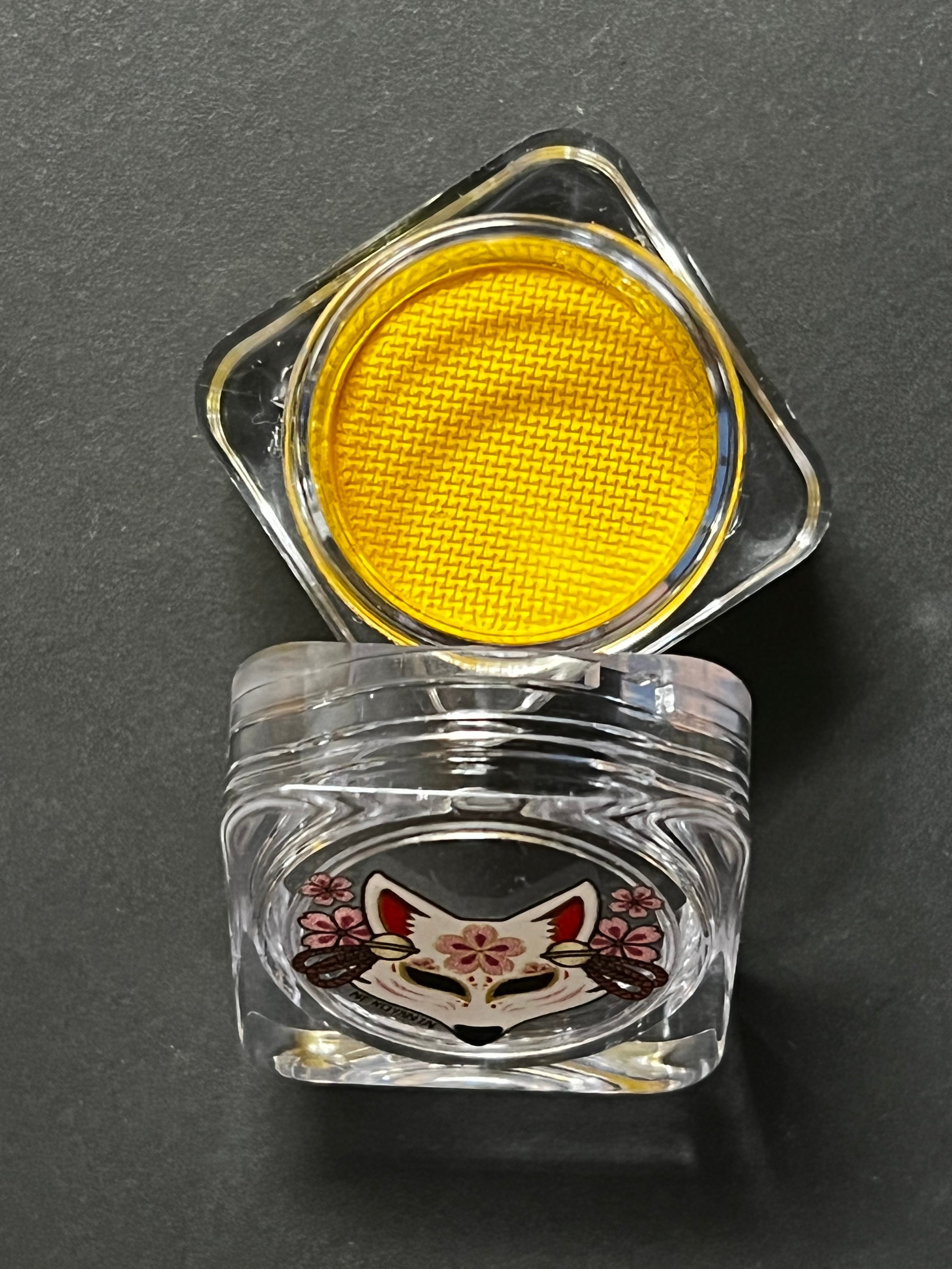 Yellow water-activated graphic liner with banana design by Nekoyanin, shown as a close-up of the colorful, vibrant eyeliner.
