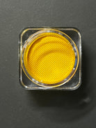 Yellow banana graphic liner by Nekoyanin, water-activated makeup liner with vibrant banana design on black background.