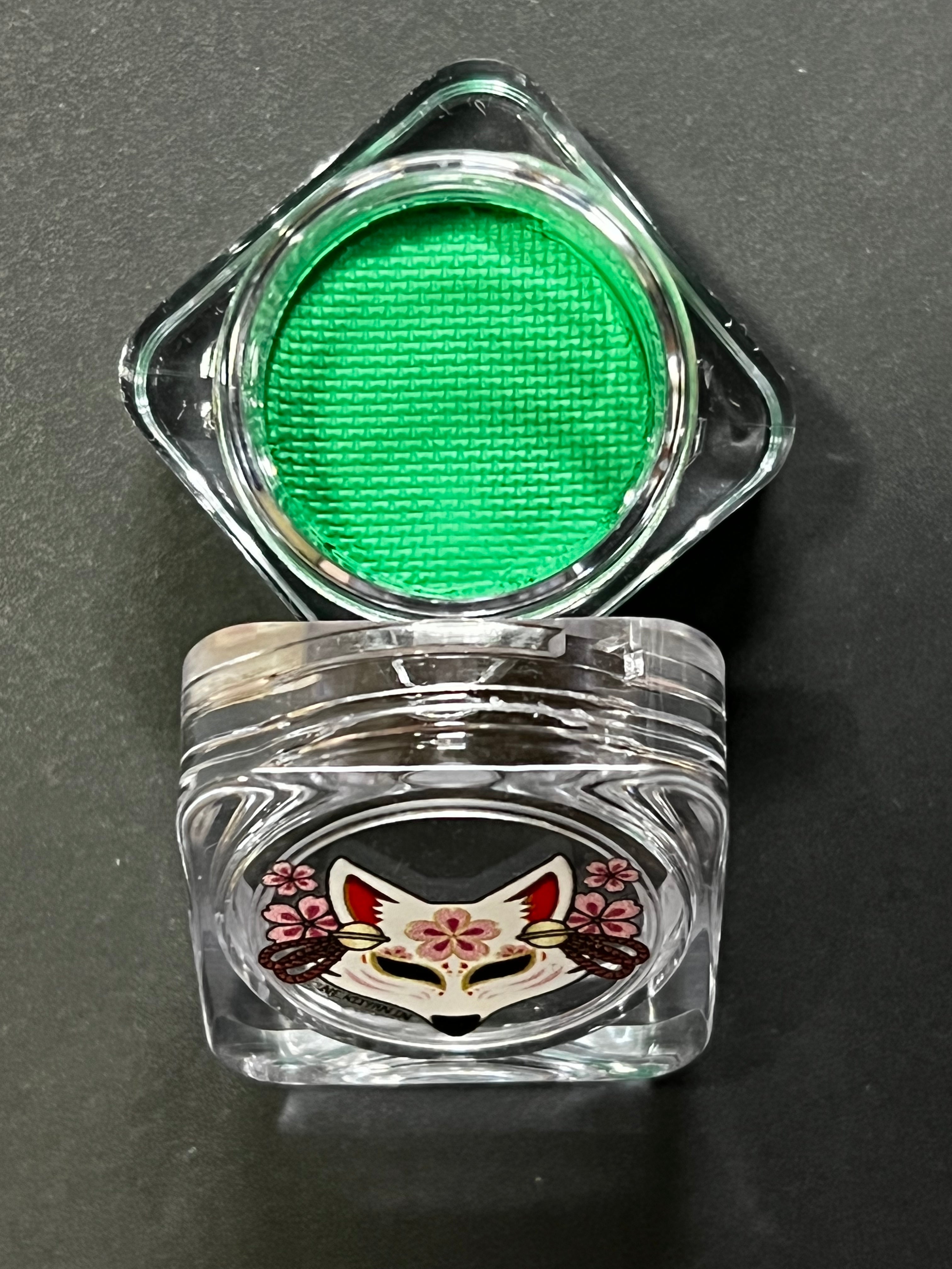 Nekoyanin Emerald Water Activated Graphic Liner with vibrant green color and detailed design, perfect for creative eye makeup.
