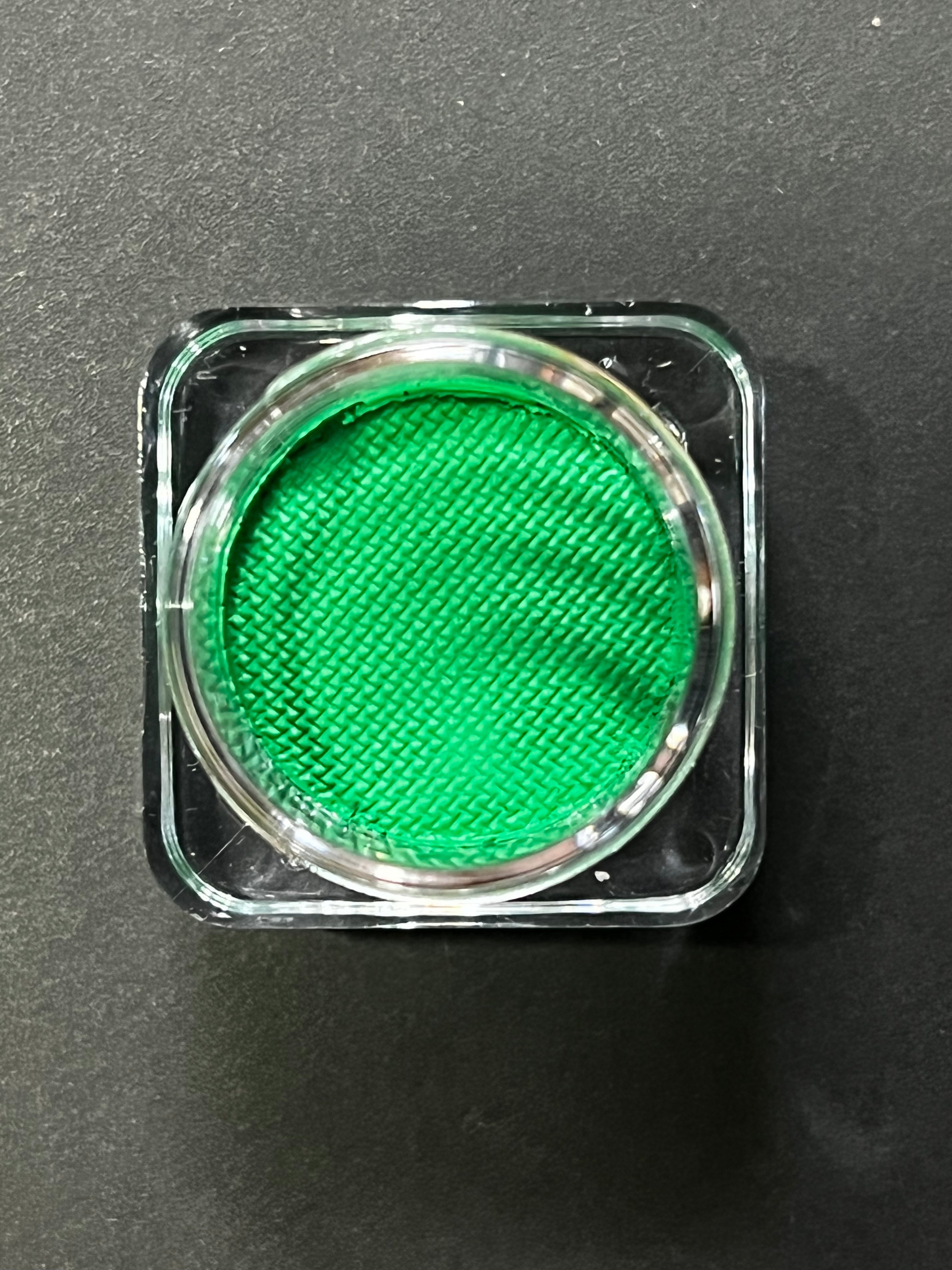 Green water-activated graphic eyeliner by Nekoyanin, featuring vibrant emerald color and intricate design for bold eye makeup.