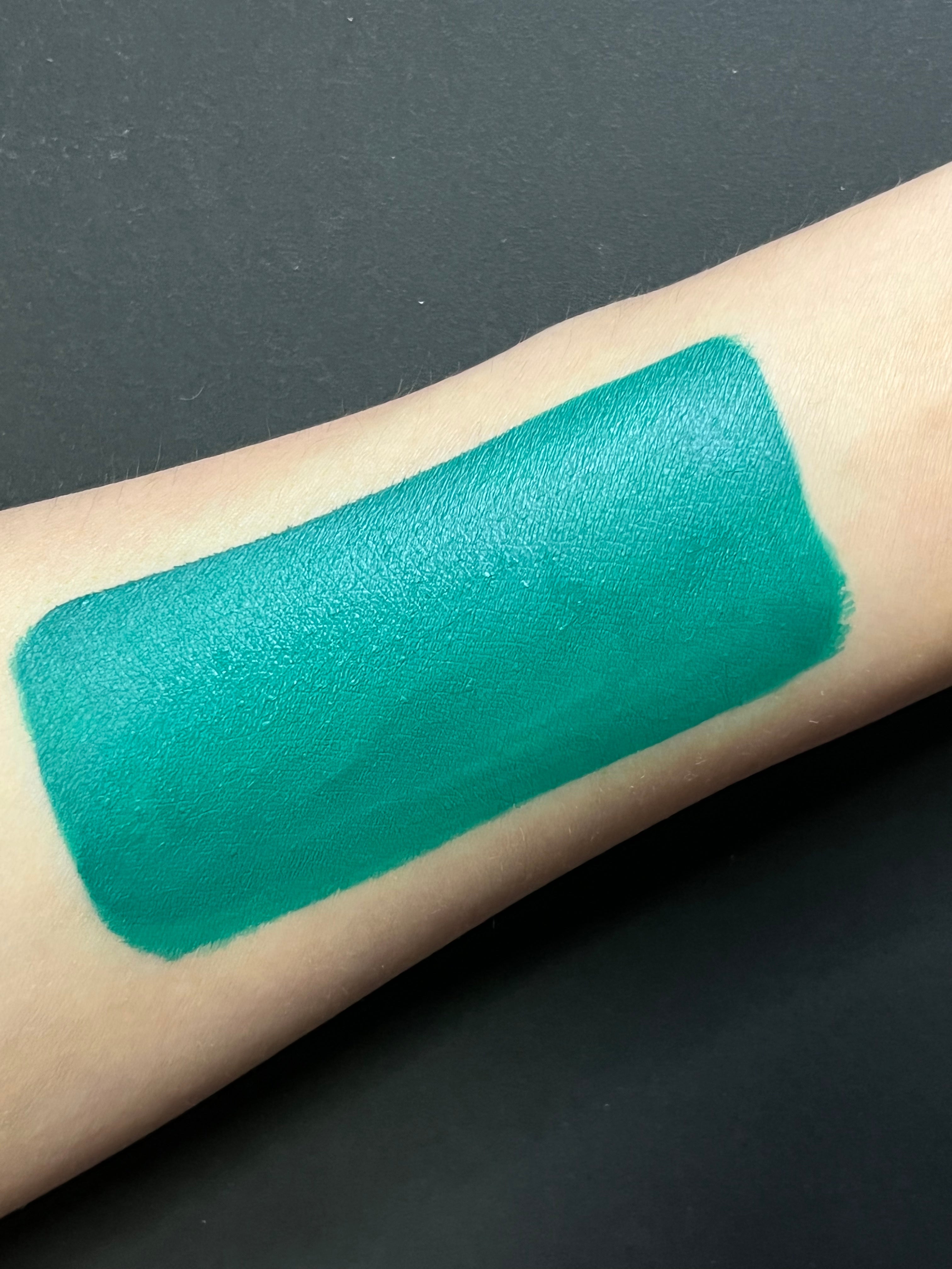 Nekoyanin Aqua Water Activated Graphic Liner in turquoise, displayed with its vibrant color and sleek design on a white background.