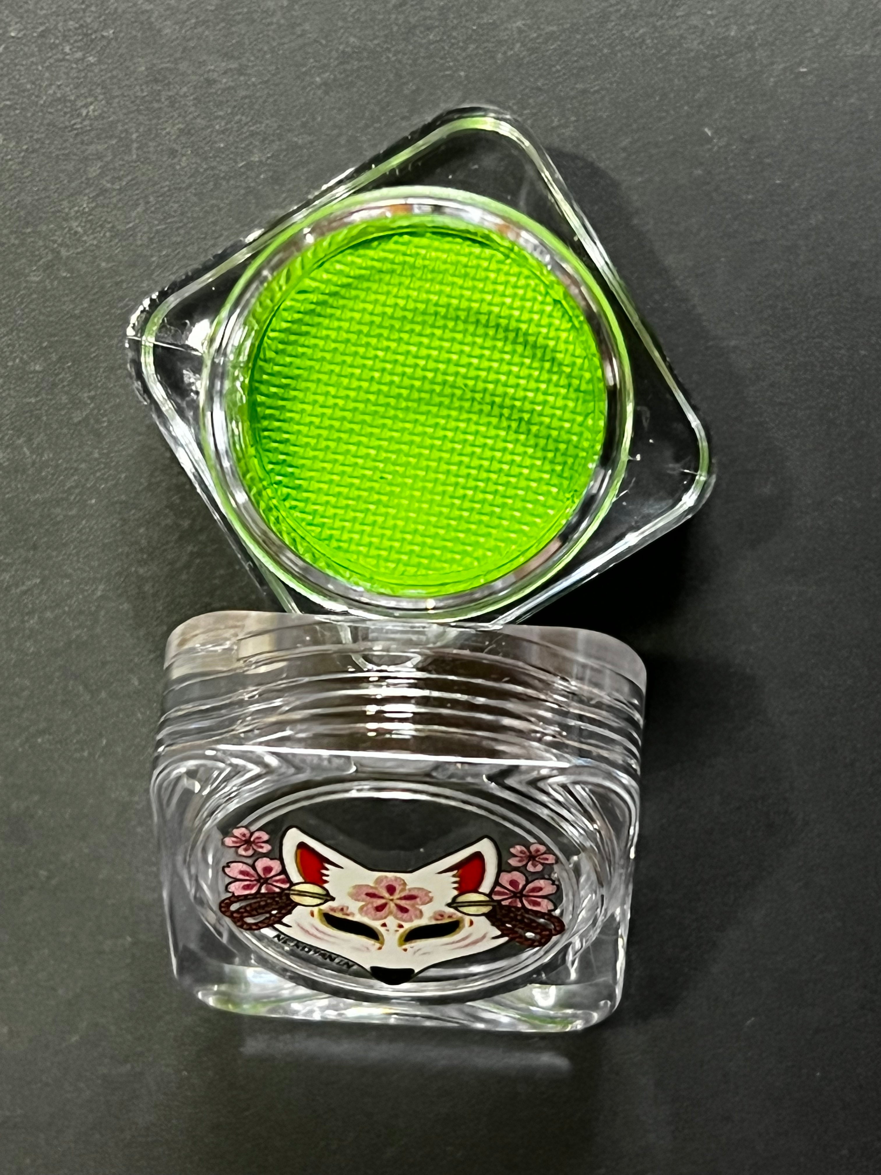 Green water-activated graphic liner by Nekoyanin in shade Kelly, showing the vibrant, detailed design on the product.