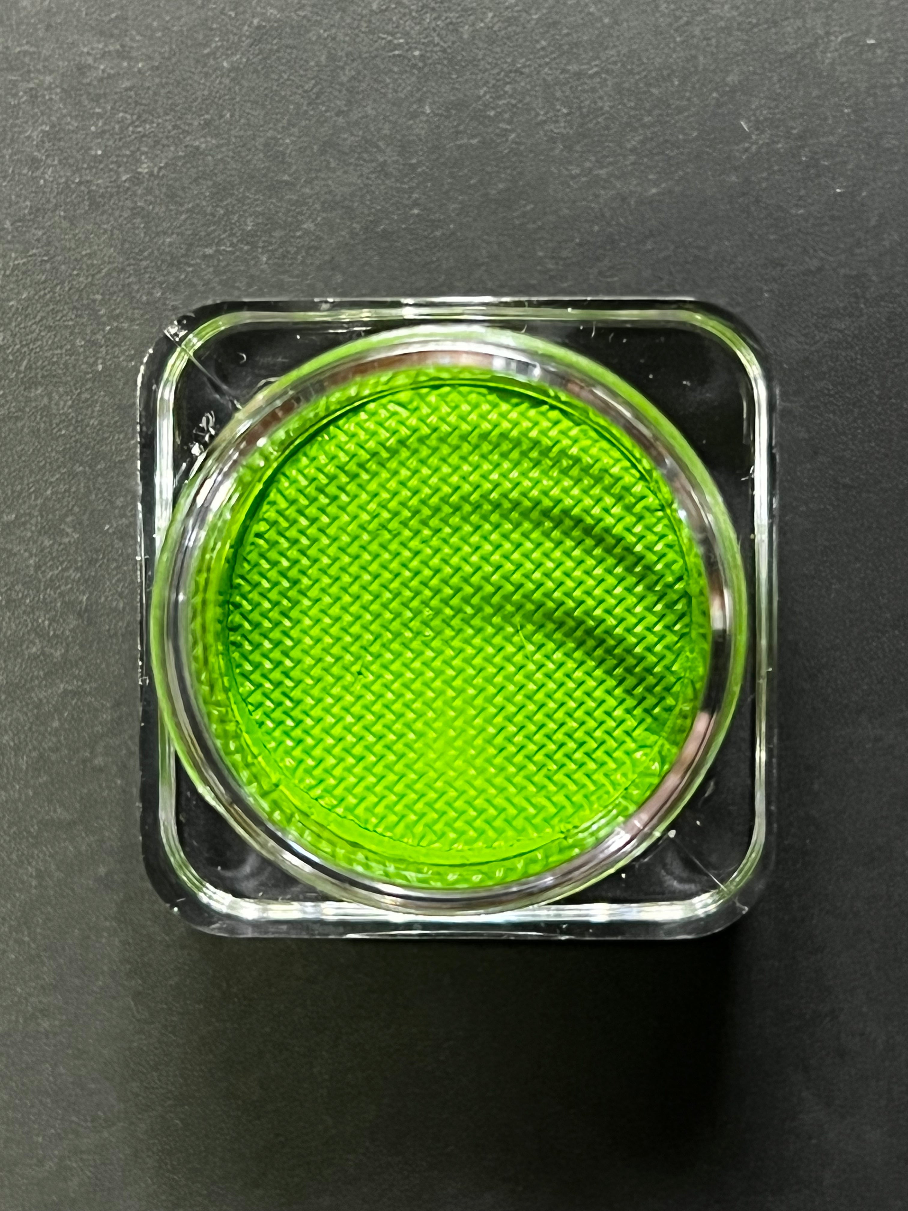 Nekoyanin 22 Kelly green water-activated graphic liner with vibrant, bold ink visible on smooth eyeliner surface.