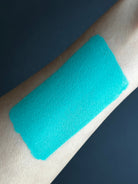 Nekoyanin 23 Cyan blue water-activated graphic liner with a vibrant, bold color and precise application visible on skin.