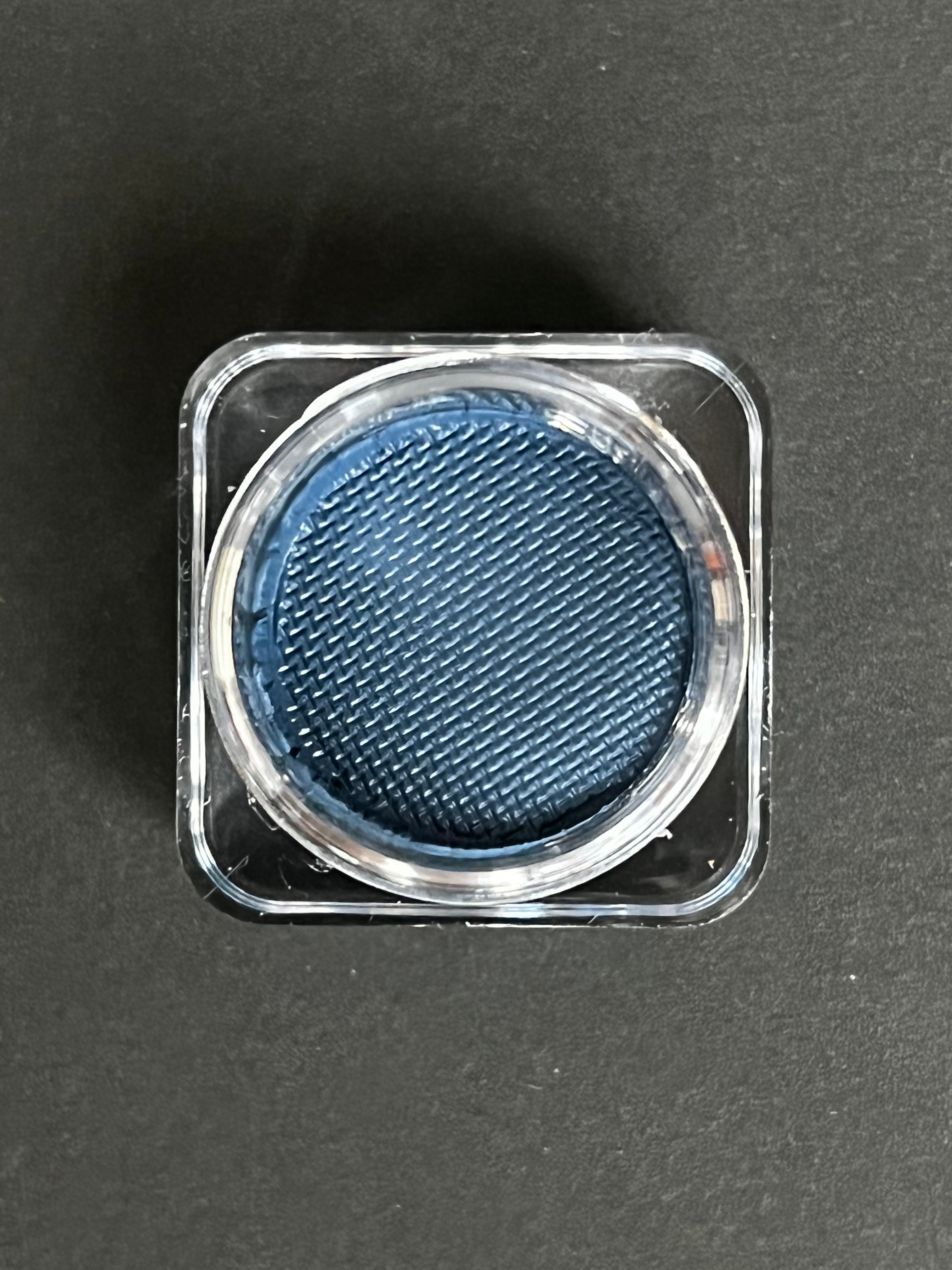 Blue denim water-activated graphic liner by Nekoyanin, featuring vibrant design and precise application on the eye area.