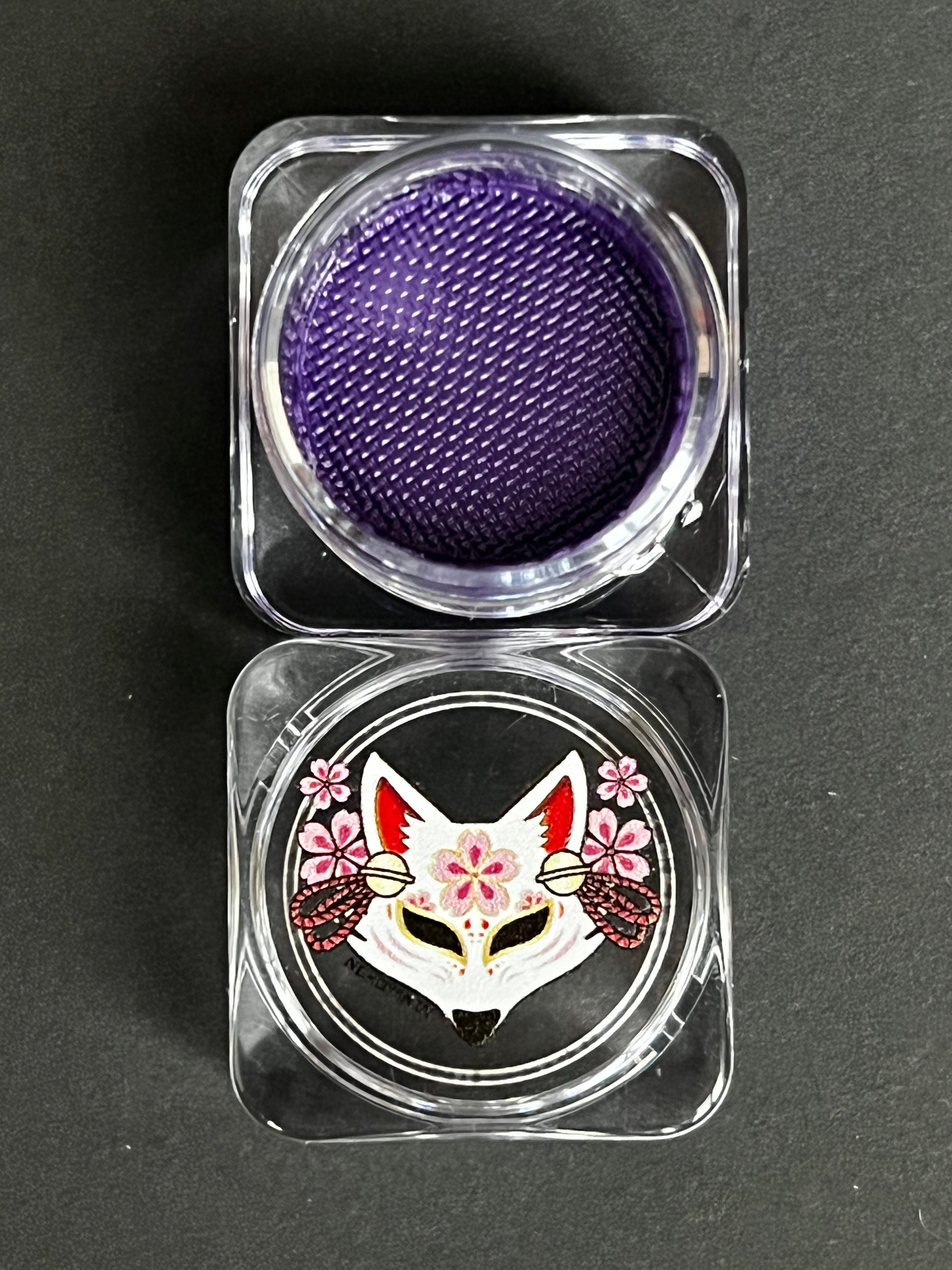 Nekoyanin Indigo (Purple) Water Activated Graphic Liner featuring a sleek, vibrant design for bold eye makeup looks.