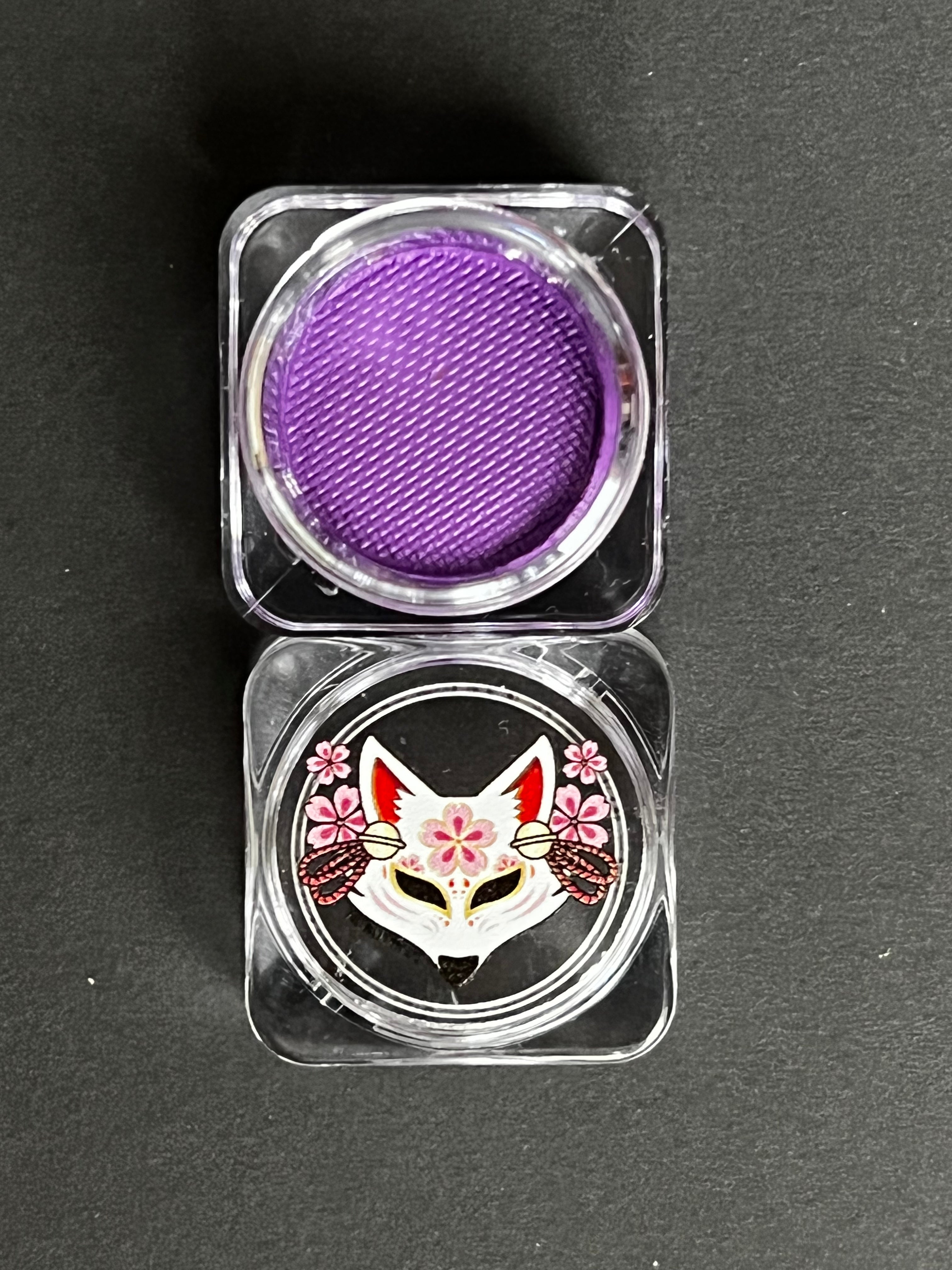 Purple Orchid Water Activated Graphic Liner by Nekoyanin, showcasing vibrant, artistic eyeliner design on a white background.