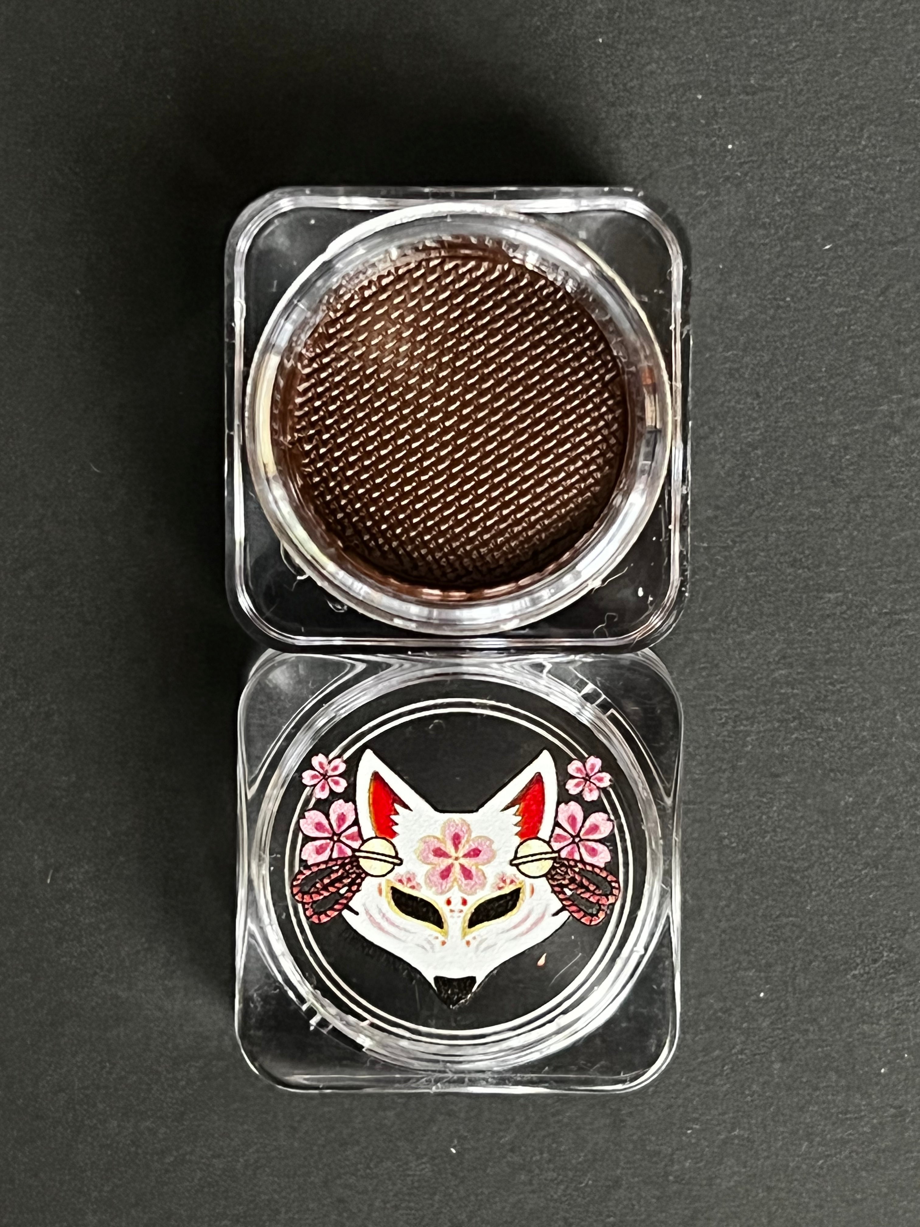 Nekoyanin Mocha brown water-activated graphic liner displayed on a white background, showing the eyeliner's color and packaging.