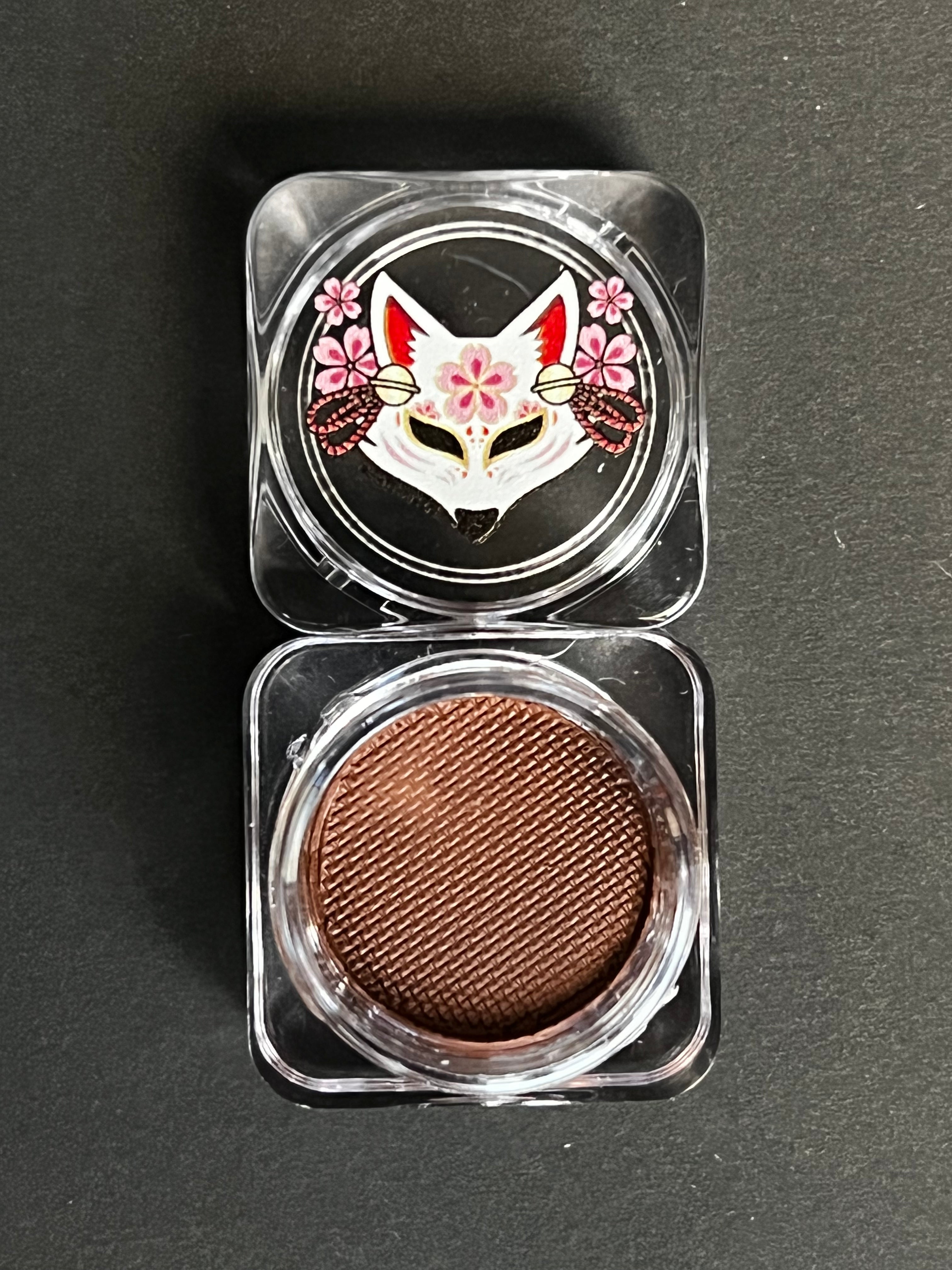 Nekoyanin 38 Chocolate Brown Water Activated Graphic Liner, close-up showing smooth application and vibrant color on skin.