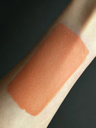 Brown water-activated graphic eyeliner in Sandy shade by Nekoyanin, shown in a close-up image highlighting its design.