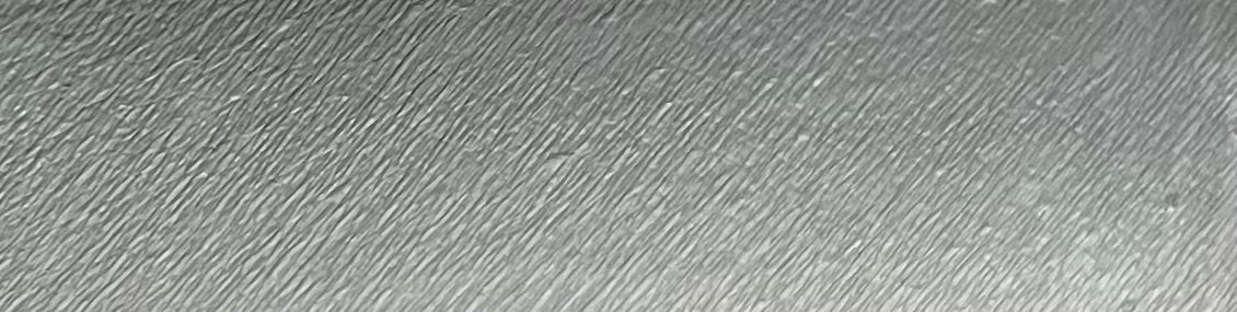 Water activated graphic liner in steel gray by Nekoyanin, showcasing a sleek, metallic design on a cosmetic tube.