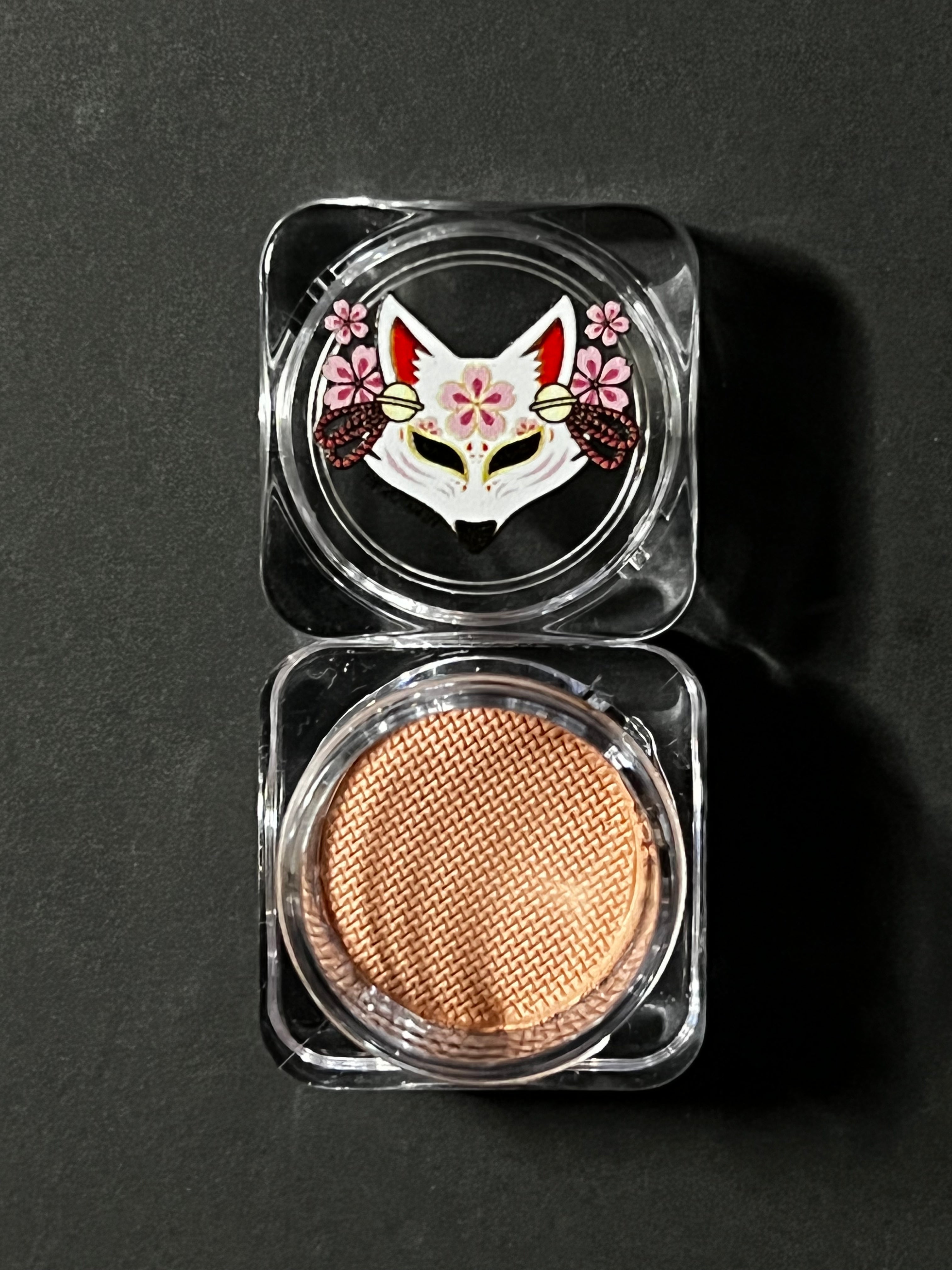 Nekoyanin Latte Brown Water Activated Graphic Liner showing brown liquid eyeliner with graphic design on a white background
