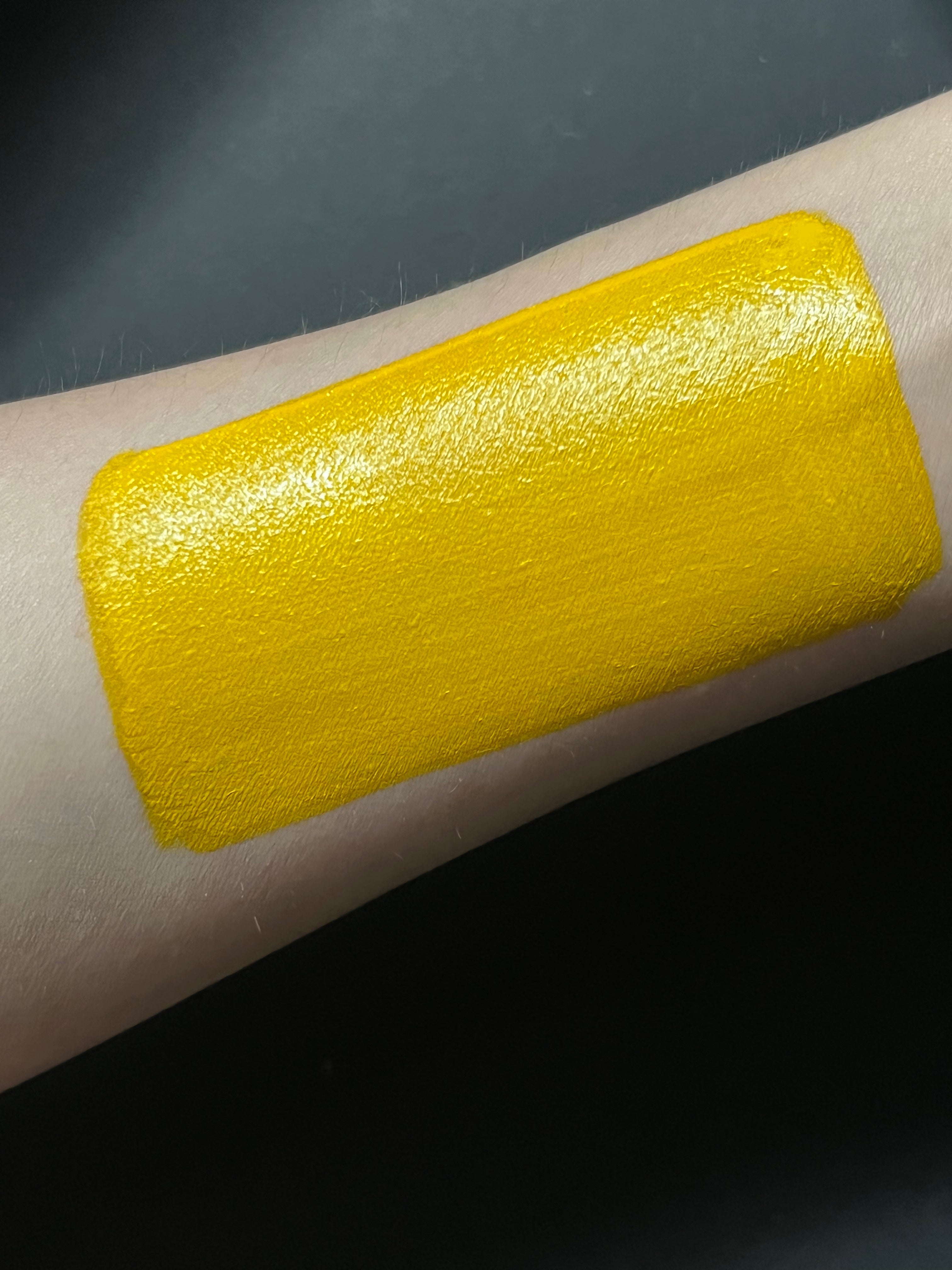 Yellow cadmium water-activated graphic liner by Nekoyanin, with a sleek applicator and vibrant color for eye makeup designs