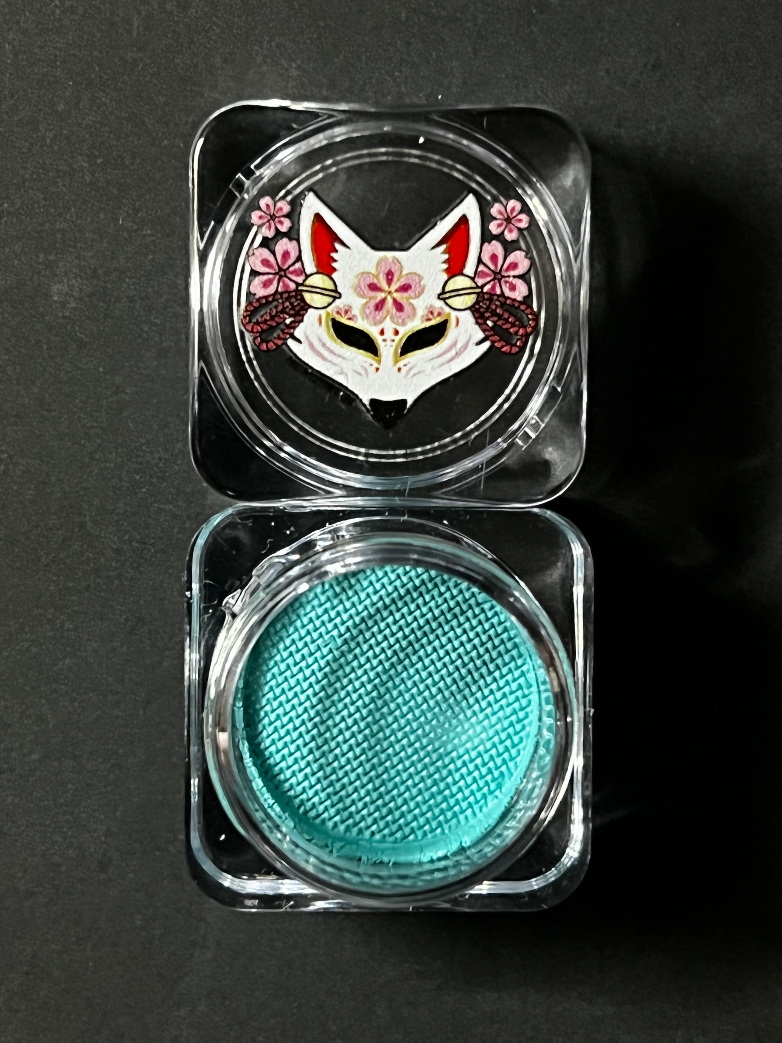 Nekoyanin 46 teal blue water-activated graphic liner showing the vibrant, water-activated ink design on a white background.
