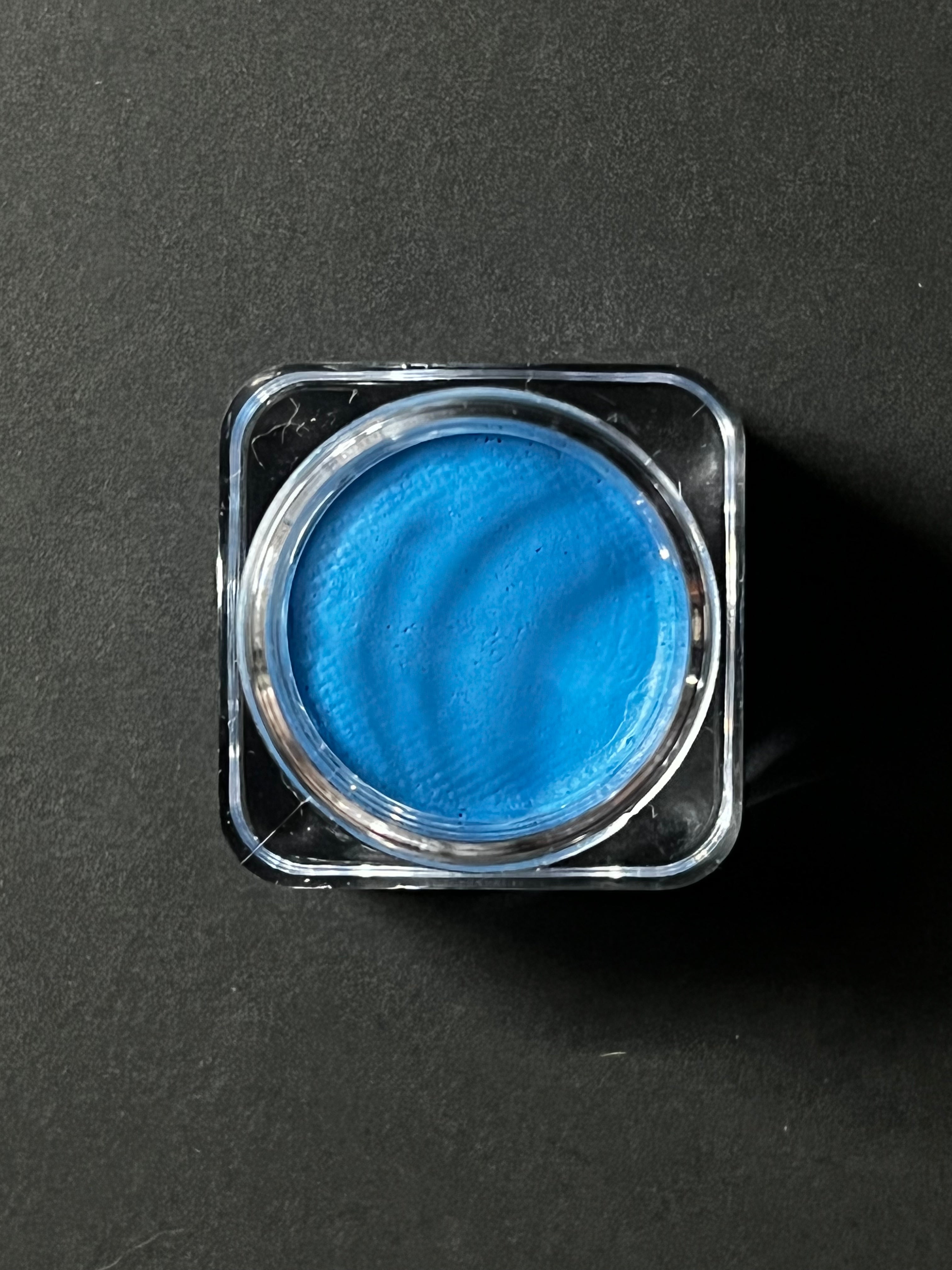 Nekoyanin 47 Sky Blue Water Activated Graphic Liner with vibrant blue ink and detailed design for eye makeup.
