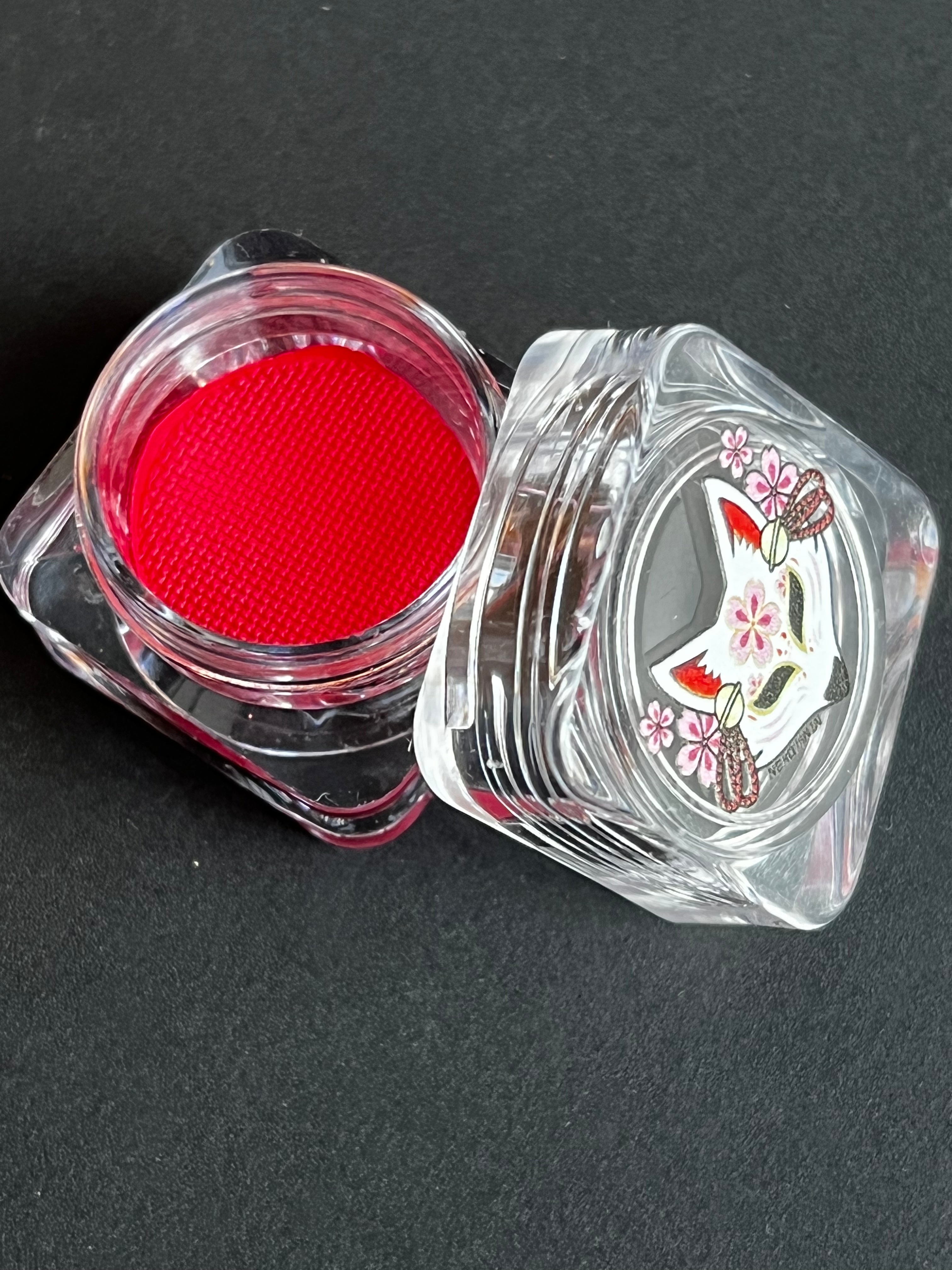 Red Amaranth water-activated graphic liner by Nekoyanin, featuring bold, vibrant color and precise application for eye makeup.