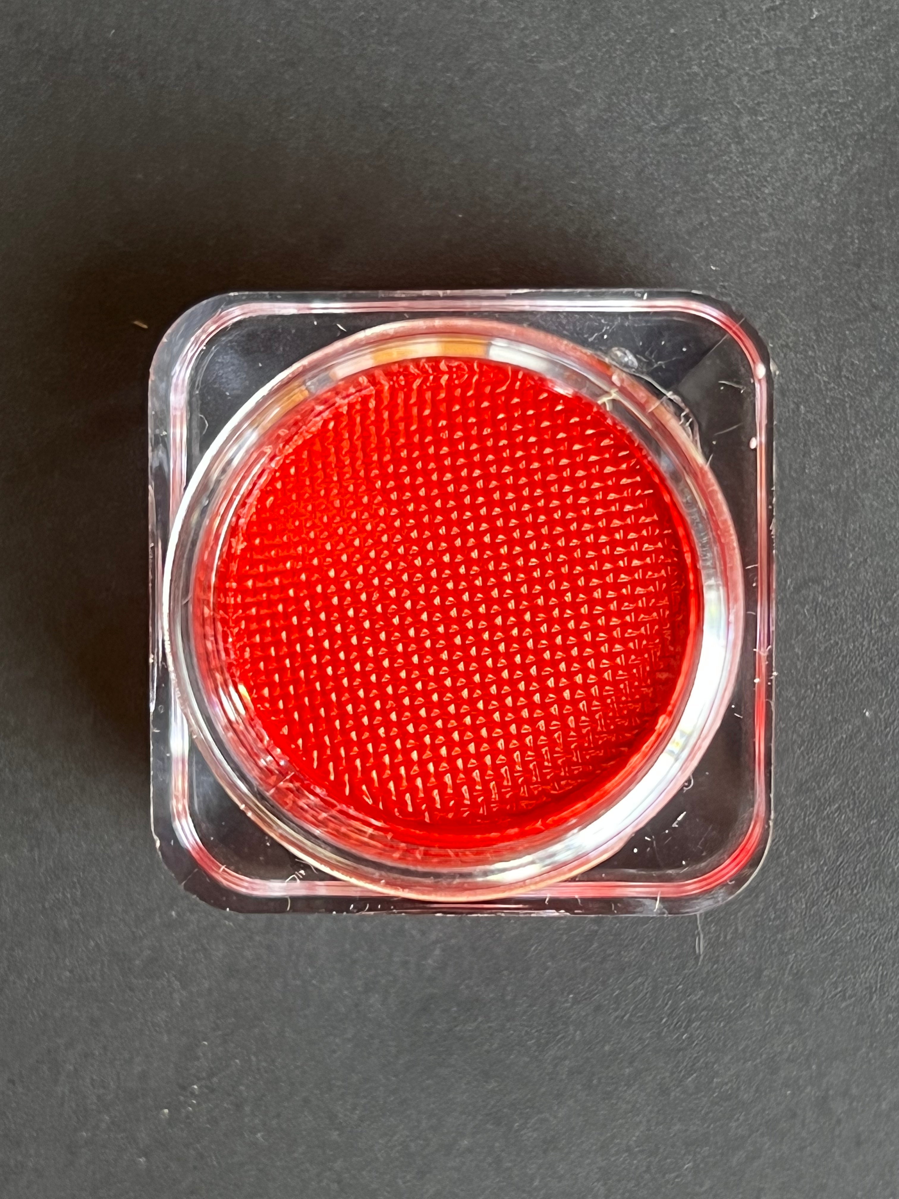 Red water-activated graphic liner in scarlet color by Nekoyanin displayed on a white background.