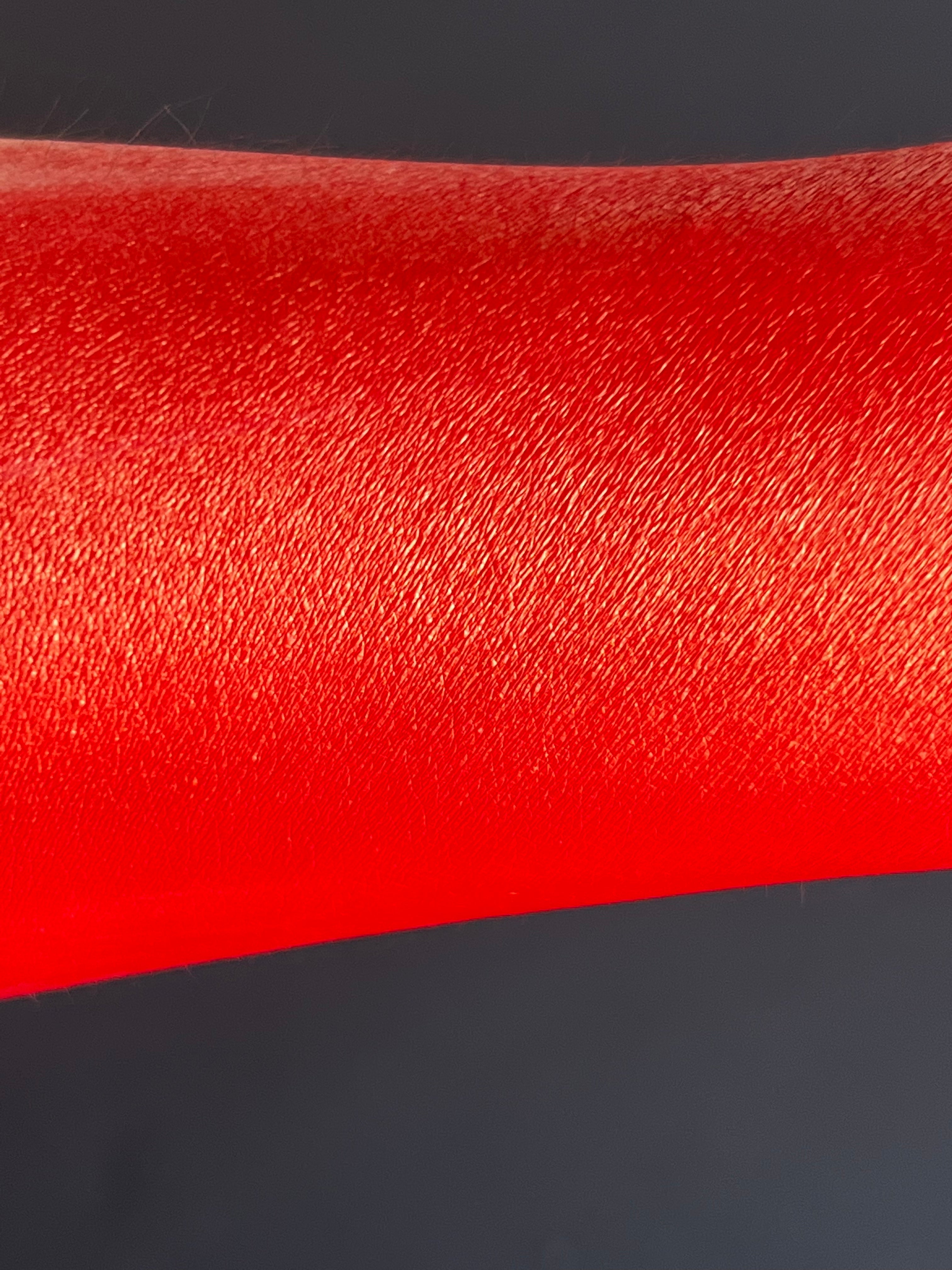 Nekoyanin Scarlet Water Activated Graphic Liner in vibrant red, with a sleek design and water-activated ink for bold eye makeup.