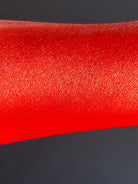 Nekoyanin Scarlet Water Activated Graphic Liner in vibrant red, with a sleek design and water-activated ink for bold eye makeup.