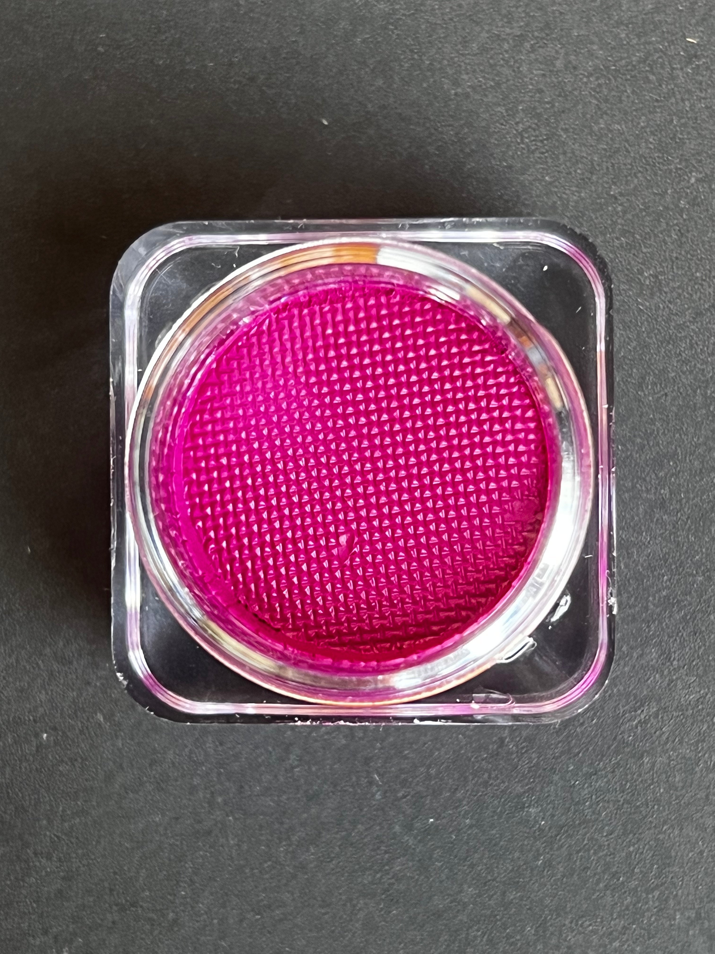 Fuchsia pink water-activated graphic eyeliner by Nekoyanin, showcasing bold, vibrant color on a sleek eyeliner pen.