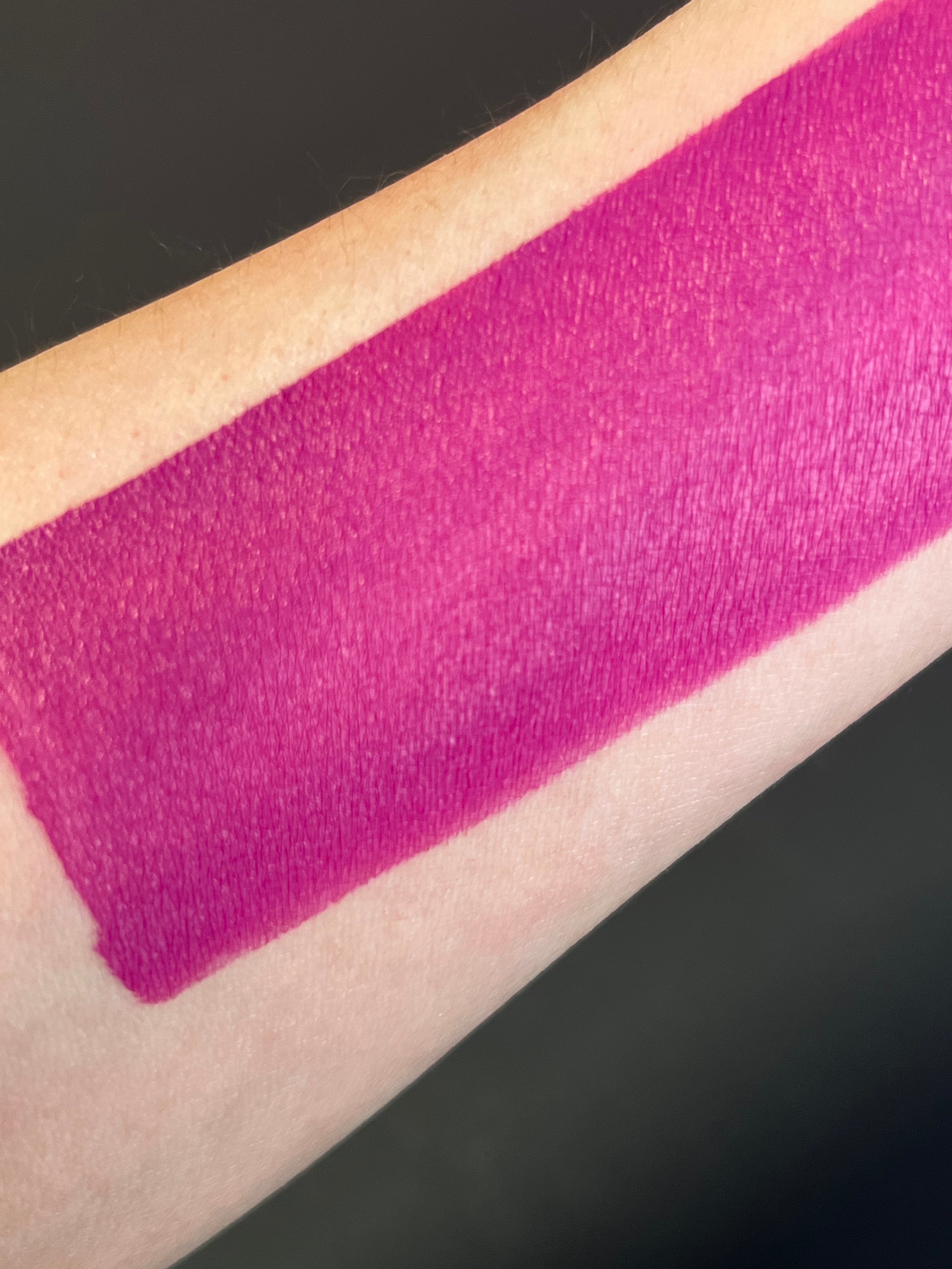 Fuchsia pink water-activated graphic eyeliner by Nekoyanin with bold, vibrant color and detailed design.