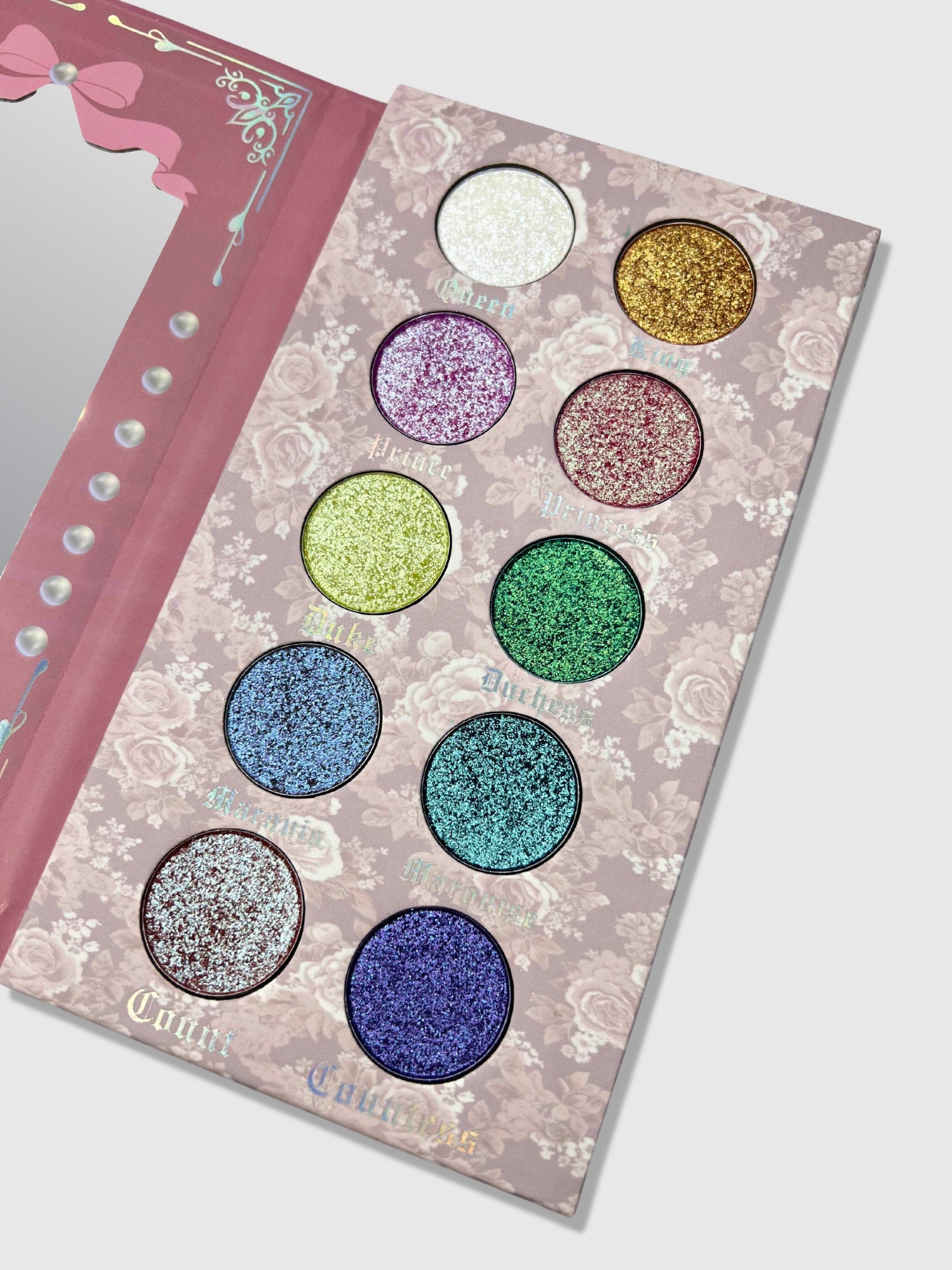 Nekoyanin Diamond of All Seasons duochrome pressed pigment palette with vibrant, shimmering eyeshadows in various shades.