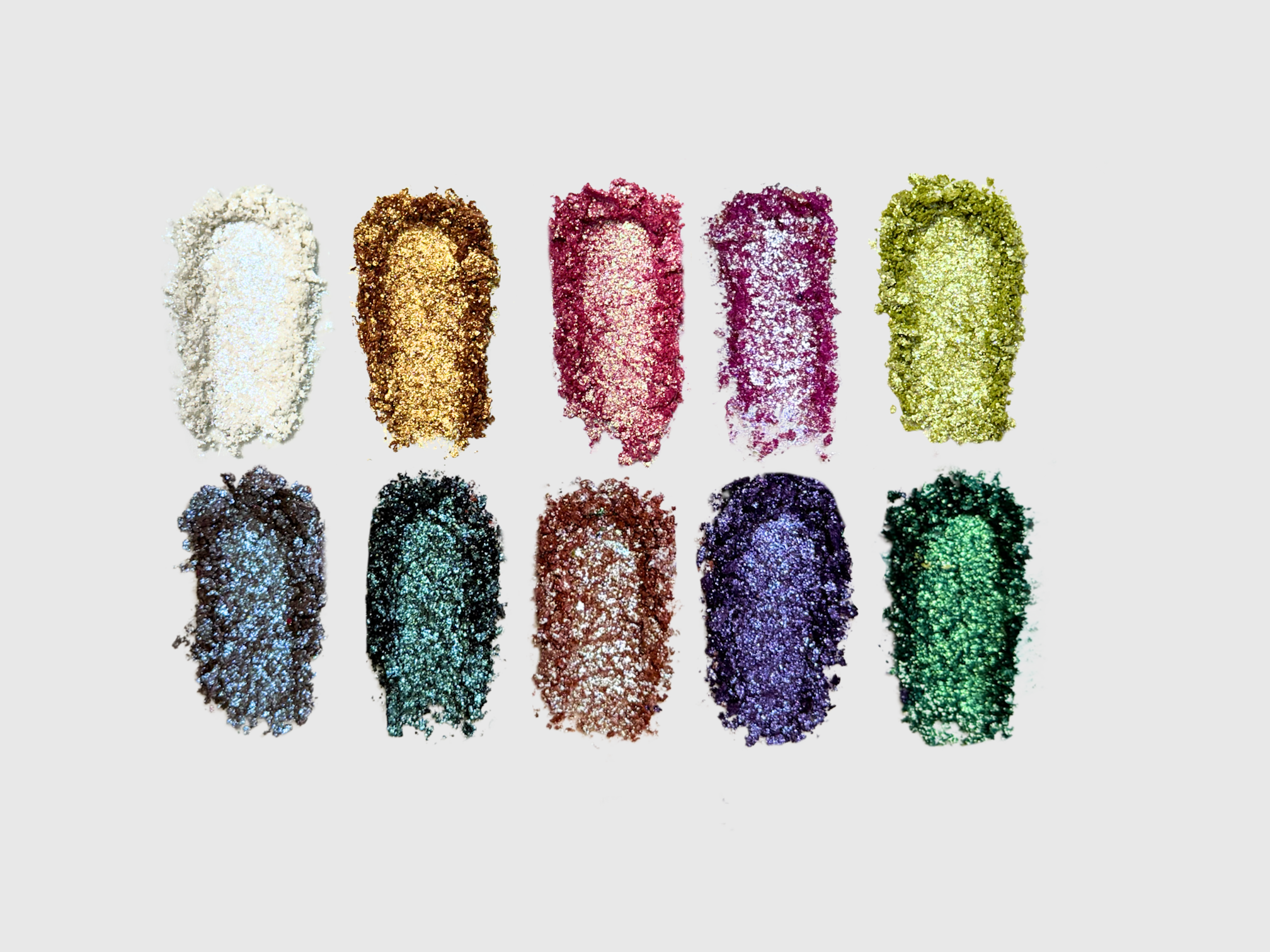 Nekoyanin Diamond of All Seasons duochrome pressed pigment palette with vibrant, shimmering eyeshadows in various seasonal shades.
