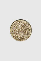 Nekoyanin Excalibur pressed pigment in a compact with vibrant, shimmery blue and purple shades on a neutral background.
