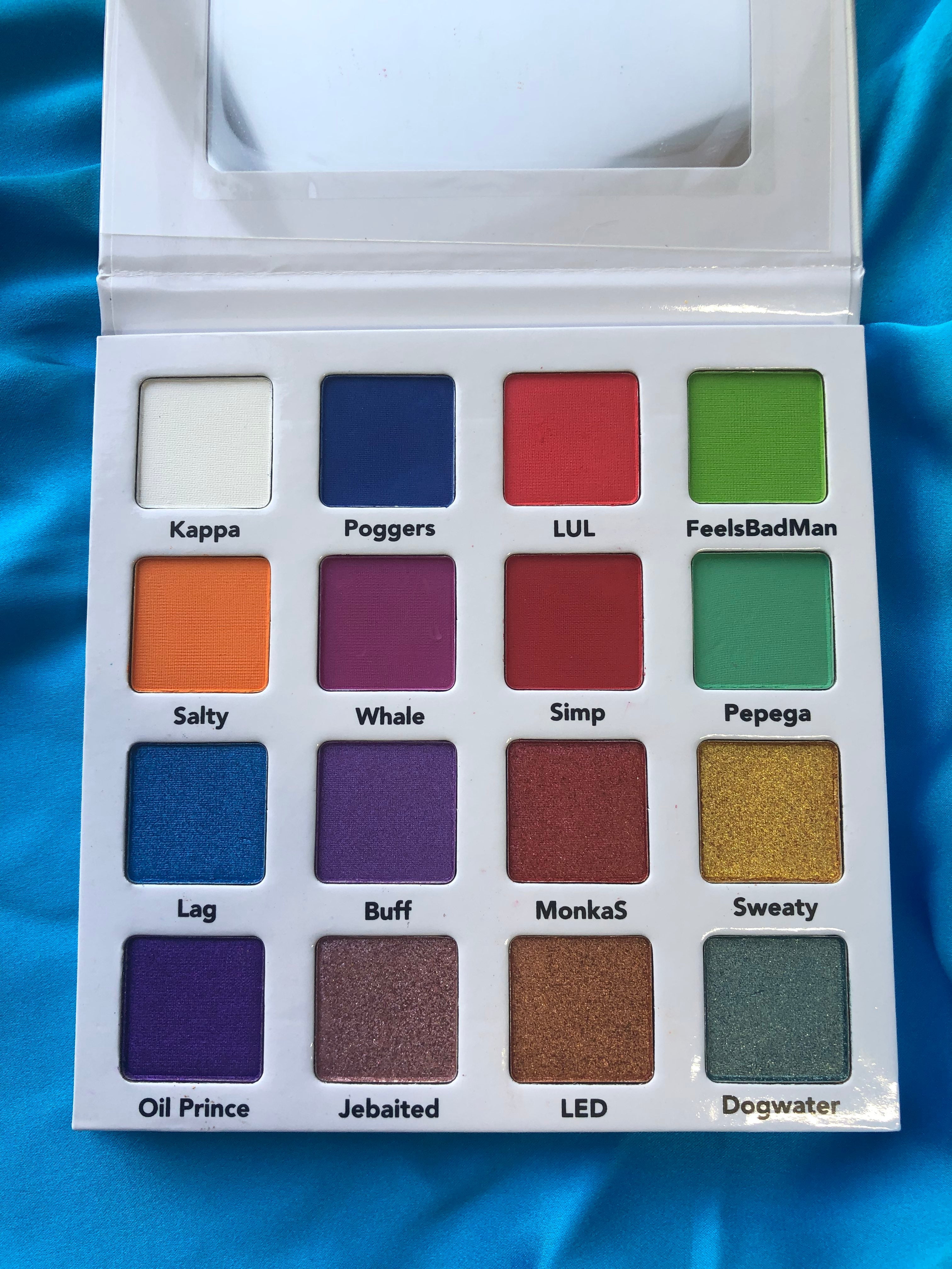 Nekoyanin Gamer Boy Palette with vibrant eyeshadow shades in a colorful makeup palette for gaming-inspired looks