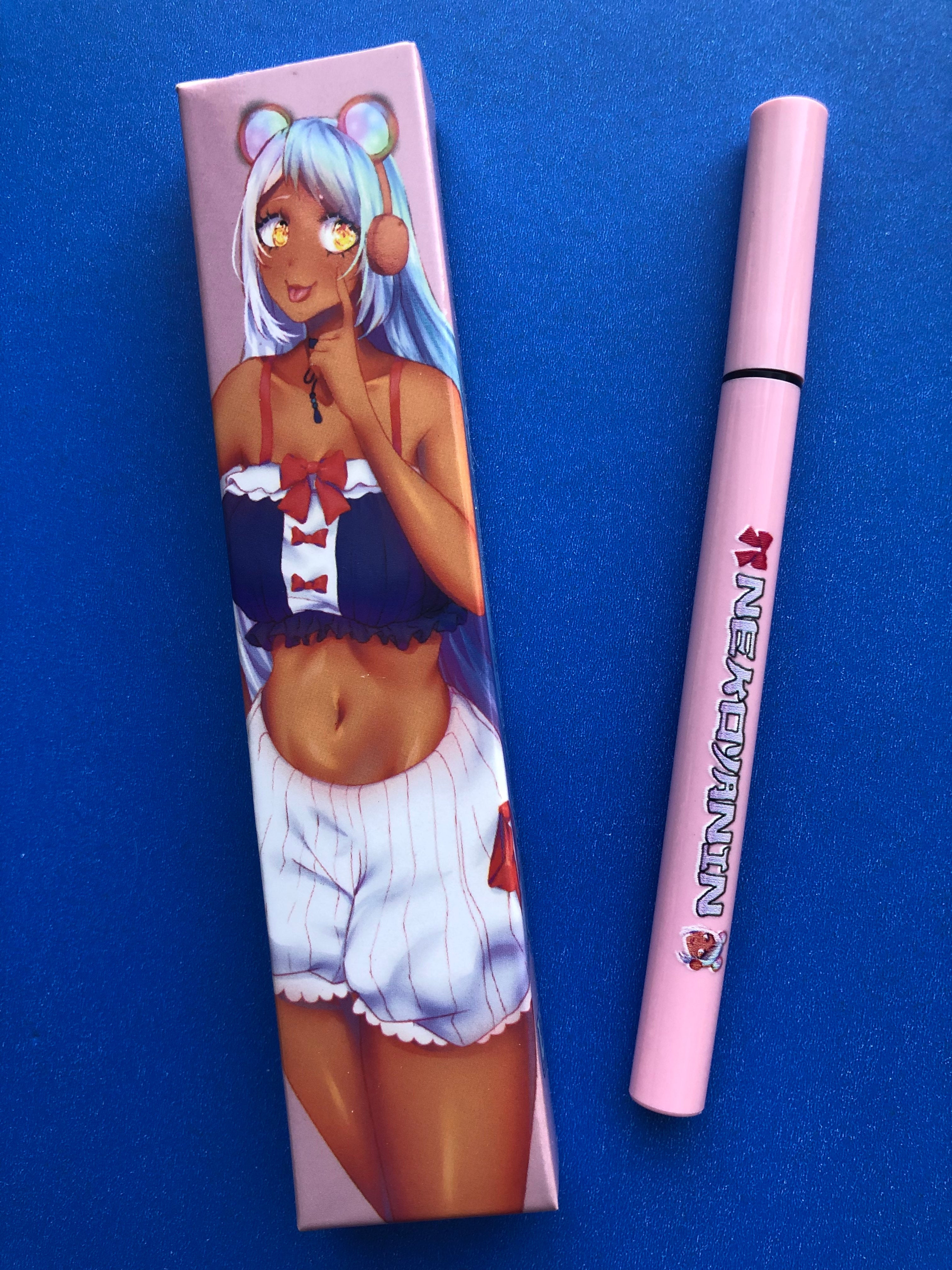 Nekoyanin Gamer Girl adhesive eyeliner applied on eyes, featuring bold black design with playful, anime-inspired style.