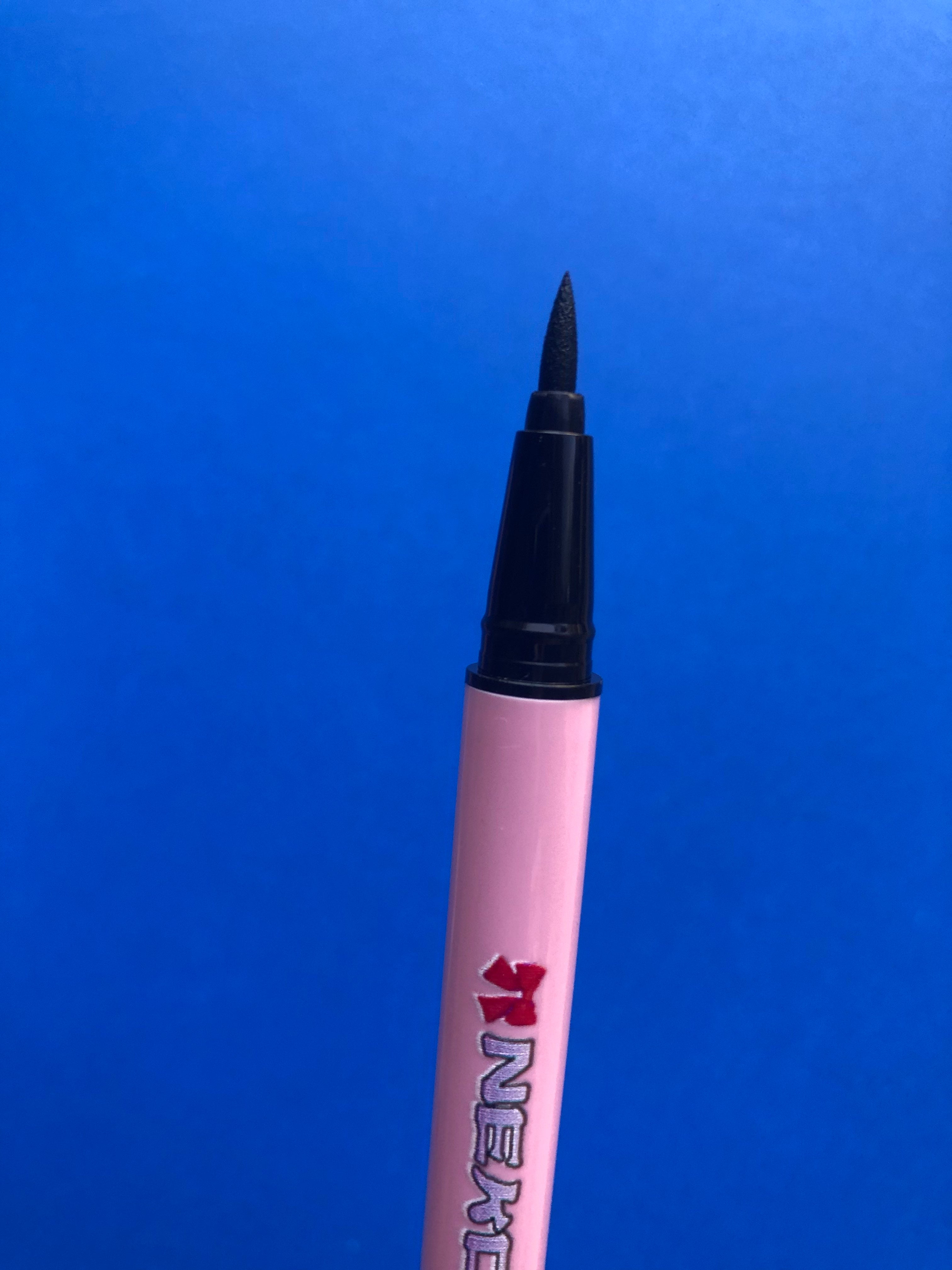 Nekoyanin Gamer Girl Adhesive Eyeliner shown on a model's eye with bold, black design, perfect for gaming-inspired makeup looks.
