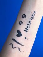 Nekoyanin Gamer Girl adhesive eyeliner with bold black design and playful graphics, perfect for a fun gaming-inspired look.