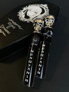 Nekoyanin Hopes and Dreams black liquid lipstick and lip gloss duo, featuring sleek black packaging and applicators.