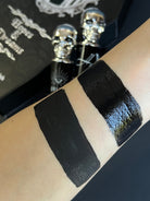 Nekoyanin Hopes And Dreams black liquid lipstick and lip gloss duo, featuring sleek black packaging and applicators.