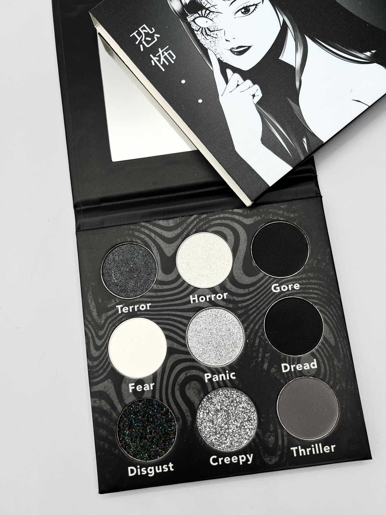 Japanese Horror Palette by Nekoyanin featuring dark, eerie eyeshadow shades in a compact palette.