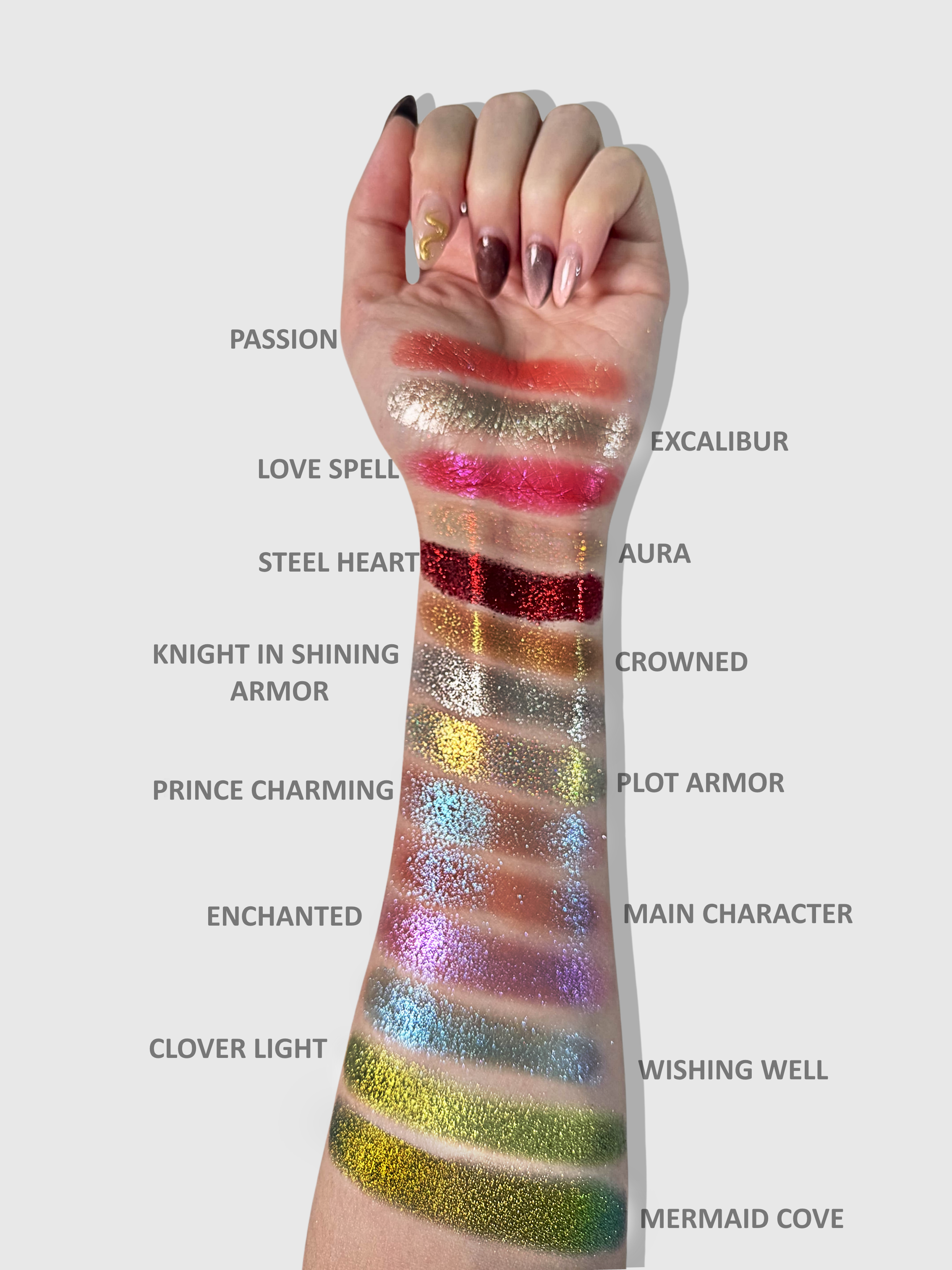 Nekoyanin Love Spell pressed pigment in a vibrant, colorful eyeshadow palette with multiple shades displayed.