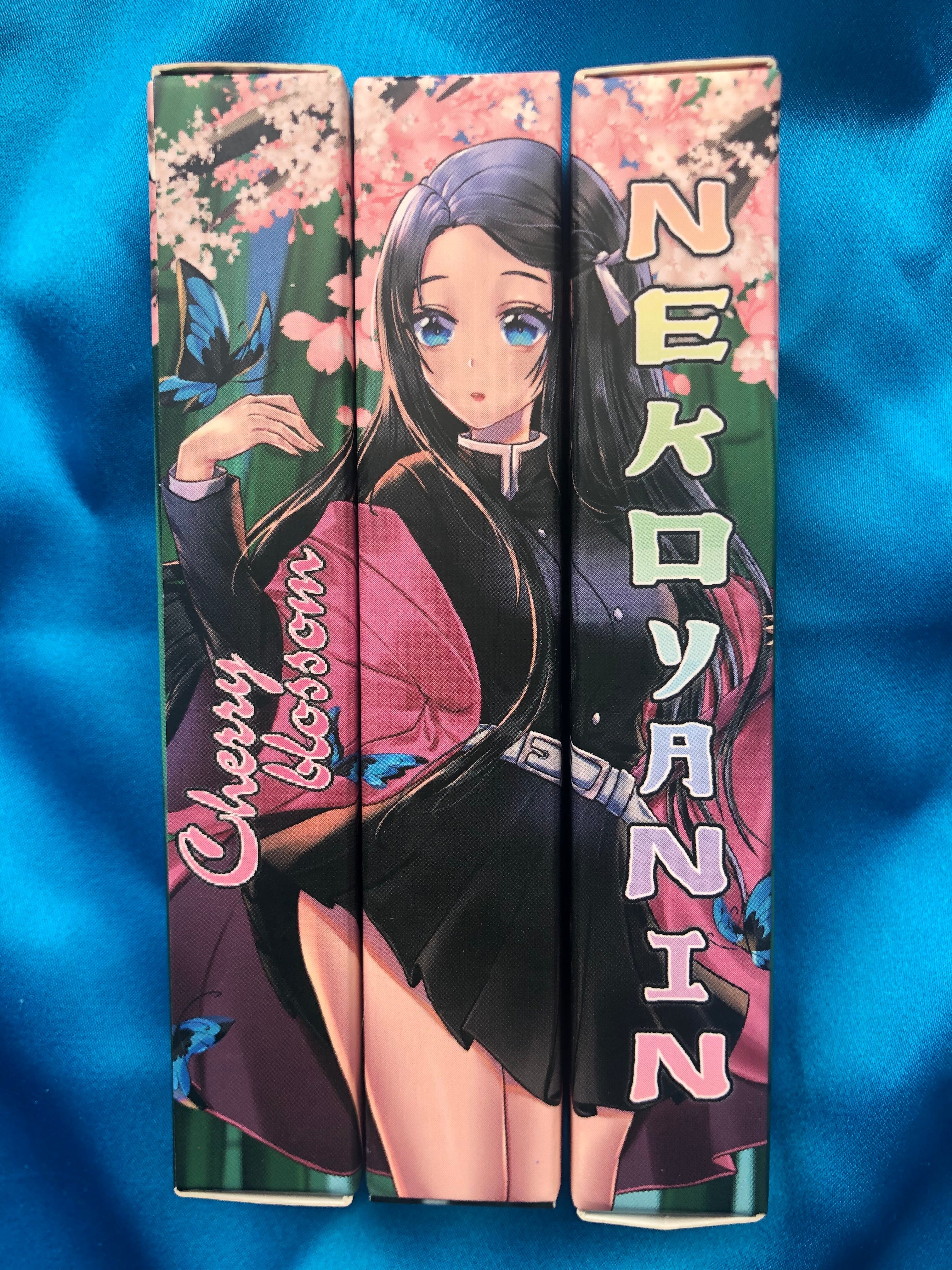 Nezuko Cherry Blossom Lipgloss by Nekoyanin, featuring a clear tube with pink tint and cherry blossom-themed packaging.