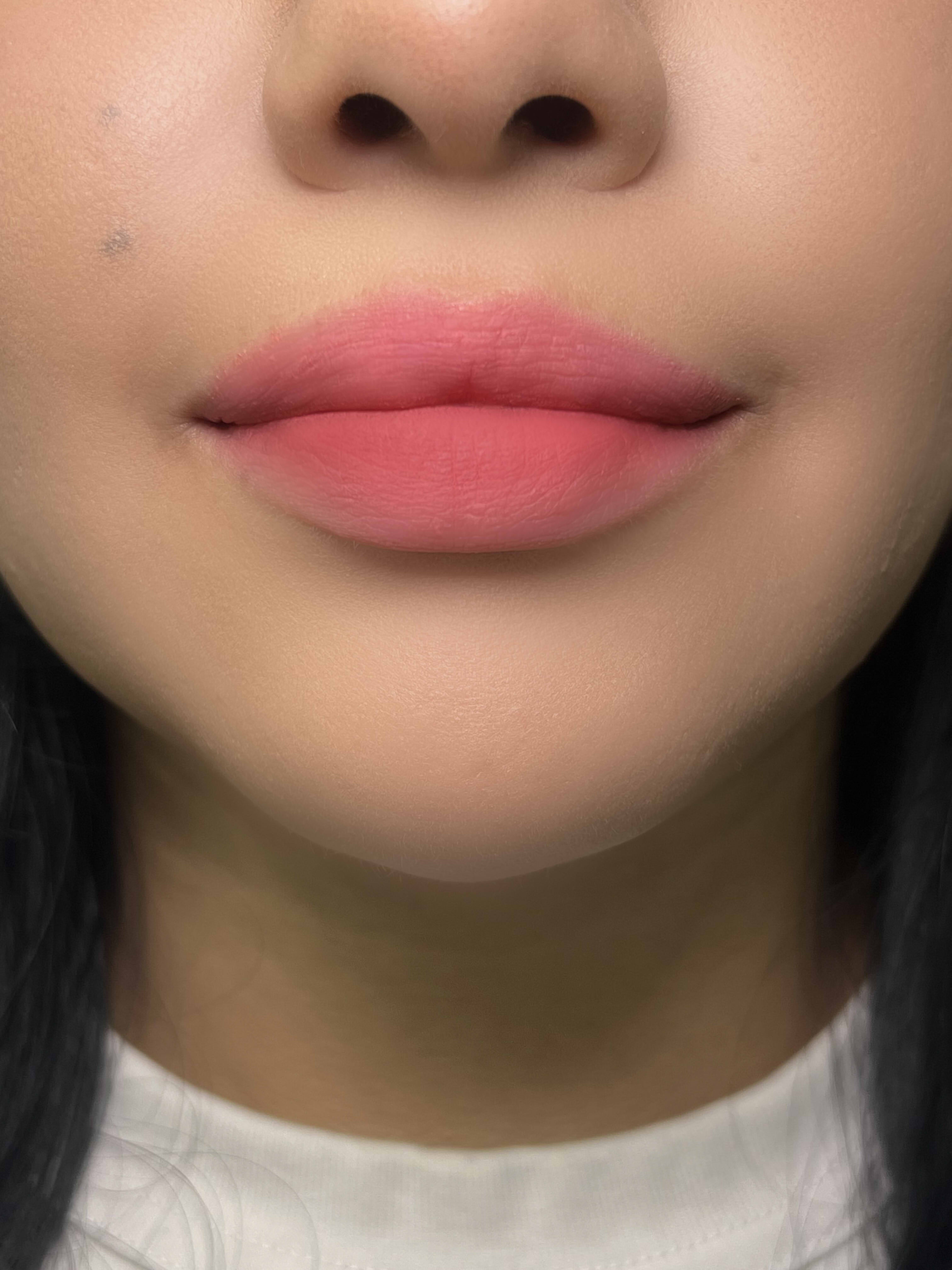 Nekoyanin Cupid Lip Mud in a vibrant pink shade, featuring heart-shaped packaging and smooth, creamy texture for lip makeup.