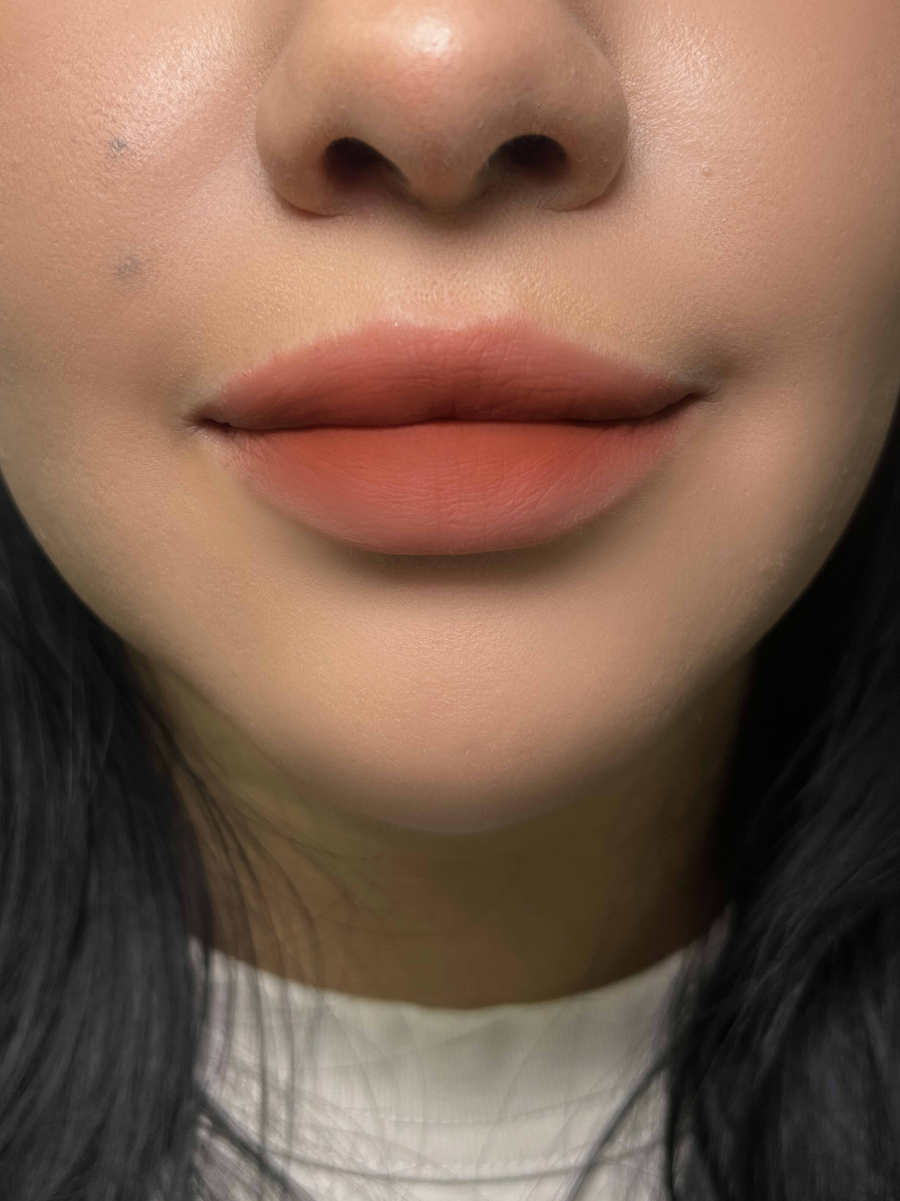 Close-up of Nekoyanin Cupid Lip Mud in a jar, showcasing the pink, creamy lip product with a smooth texture.