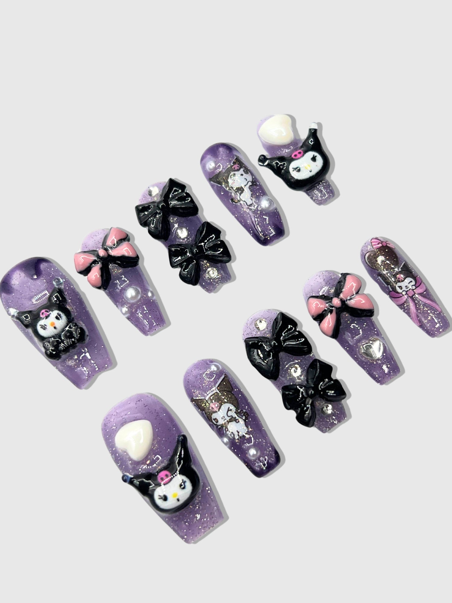 Nekoyanin Mischievous Press-On Nails with playful design, short length, and vibrant colors on a white background.