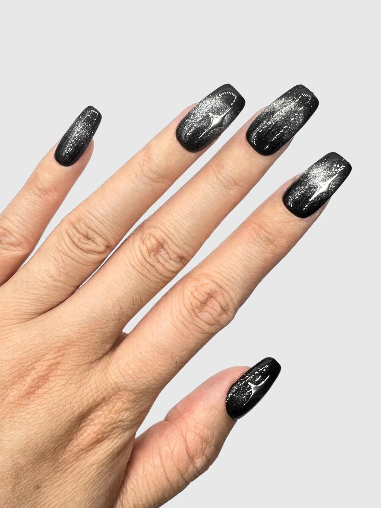 Nekoyanin Stargaze Press On Nails featuring a celestial star design on glossy, short nail tips.